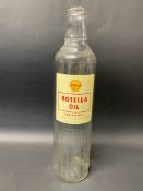 A Shell Rotella Oil quart glass bottle.