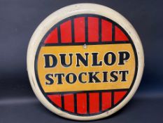 A Dunlop Stockist circular tin advertising sign, dated 1956, 24" diameter.