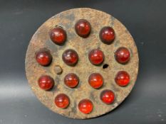 A small cast iron circular warning sign, with 14 red glass reflectors, probably AA.