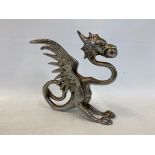 A chrome plated car mascot in the form of a griffin or dragon.