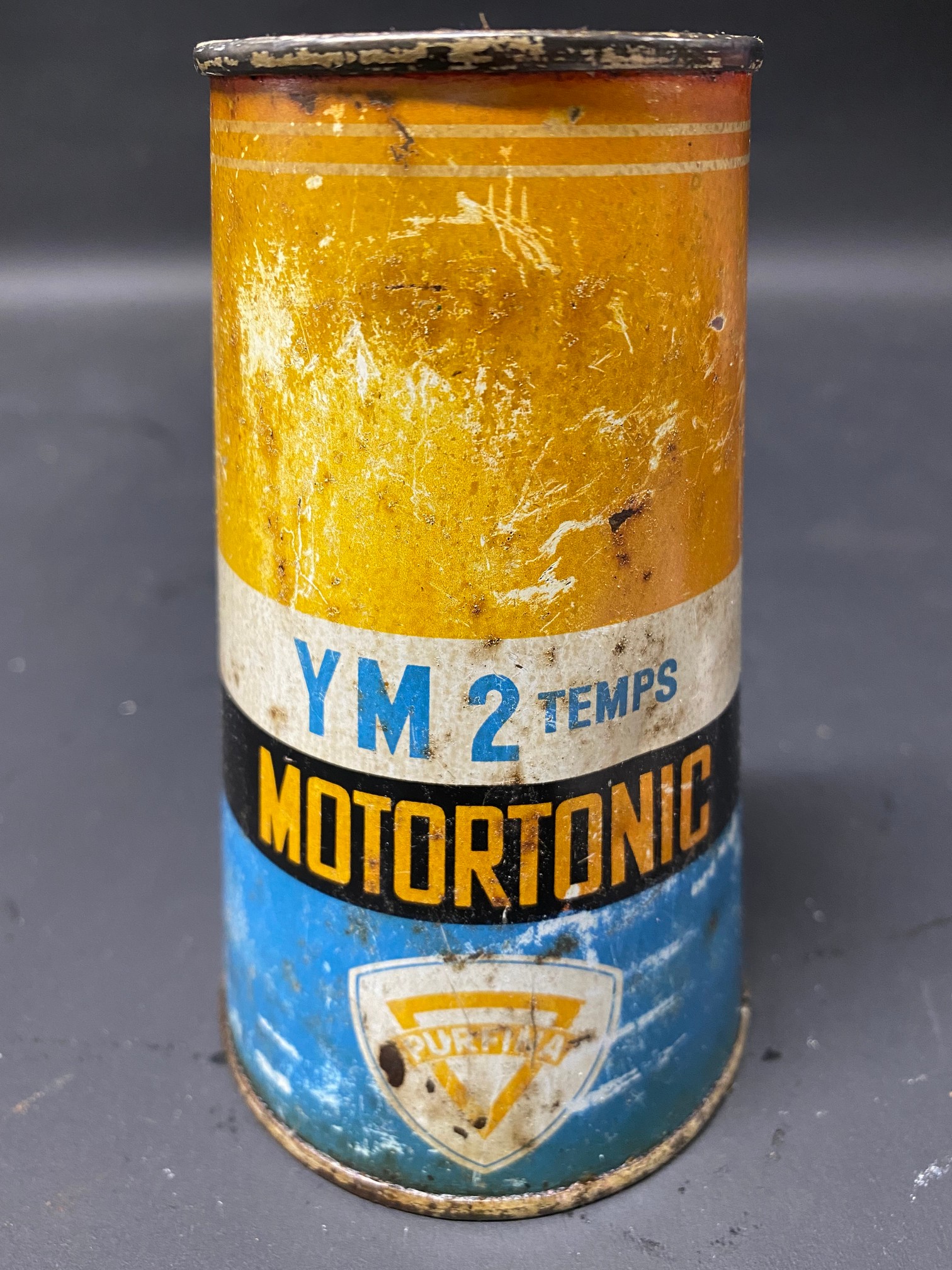 A Purfina Motortonic conical can.