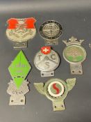 A tray of unusual car badges including one bearing the letters ARMS.