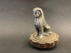 A Sphinx accessory car mascot, mounted on a radiator cap.