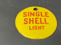 A small circular enamel brand tag for Single Shell Light, 2 3/4" diameter.