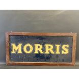 A wooden framed hardboard sign advertising Morris, 40 x 19".