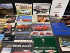 A quantity of car sales brochures, various marques including Fiat 1100, Aston Martin Lagonda, Nissan