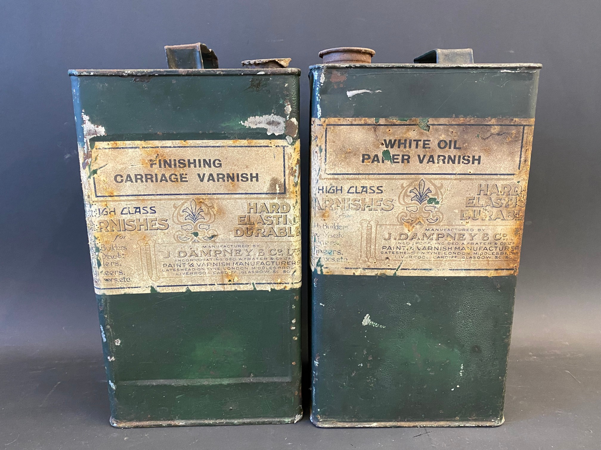 Two gallon cans each with original paper labels for Dampney & Co. carriagework varnish.