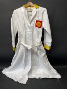 A circa 1960s Shell branded attendant's overcoat with yellow collar and cuffs, by Supercraft of