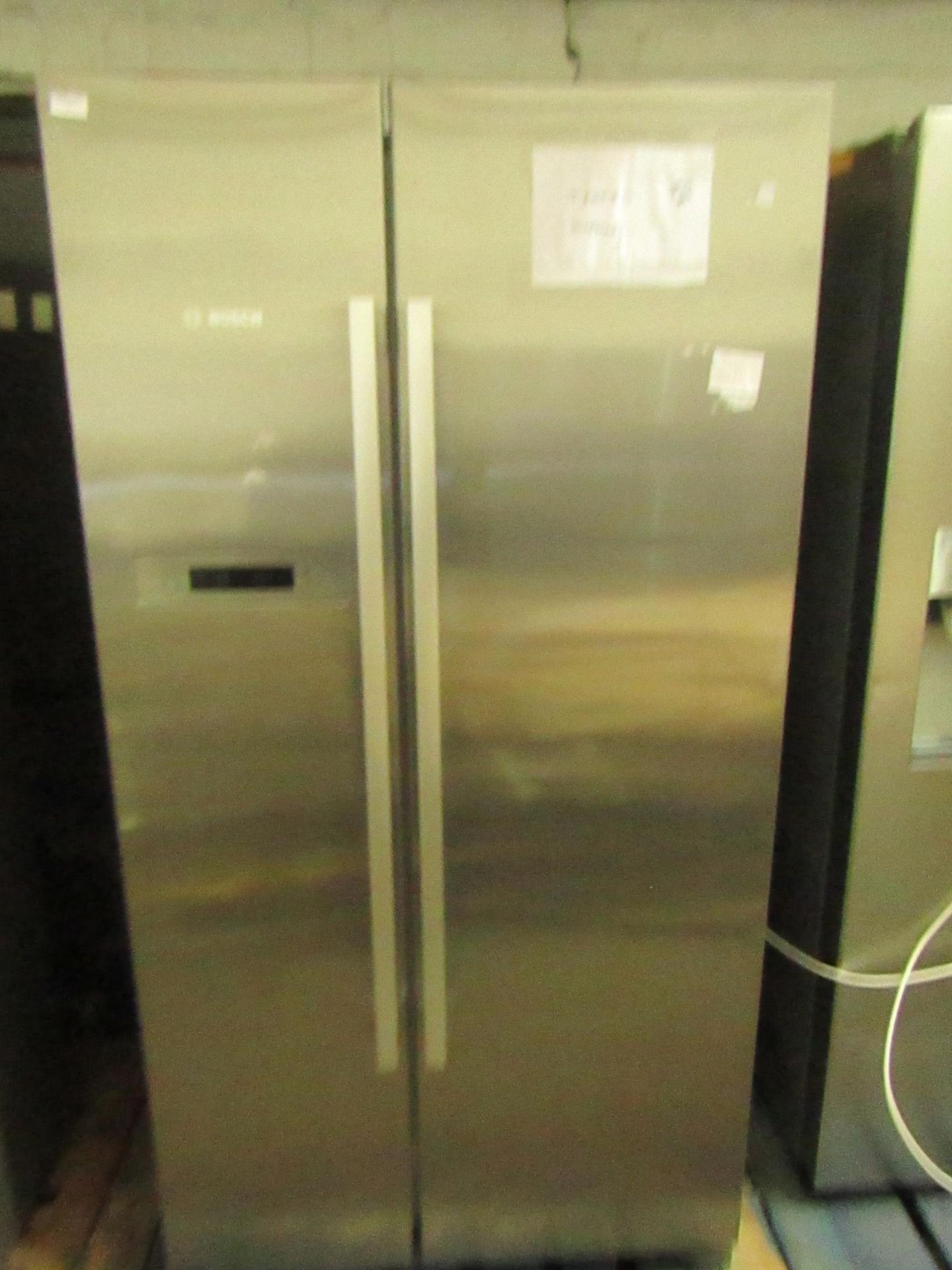 Bosch - American Fridge Freezer, Tested working and gets cold, has a small dent and blemish on the