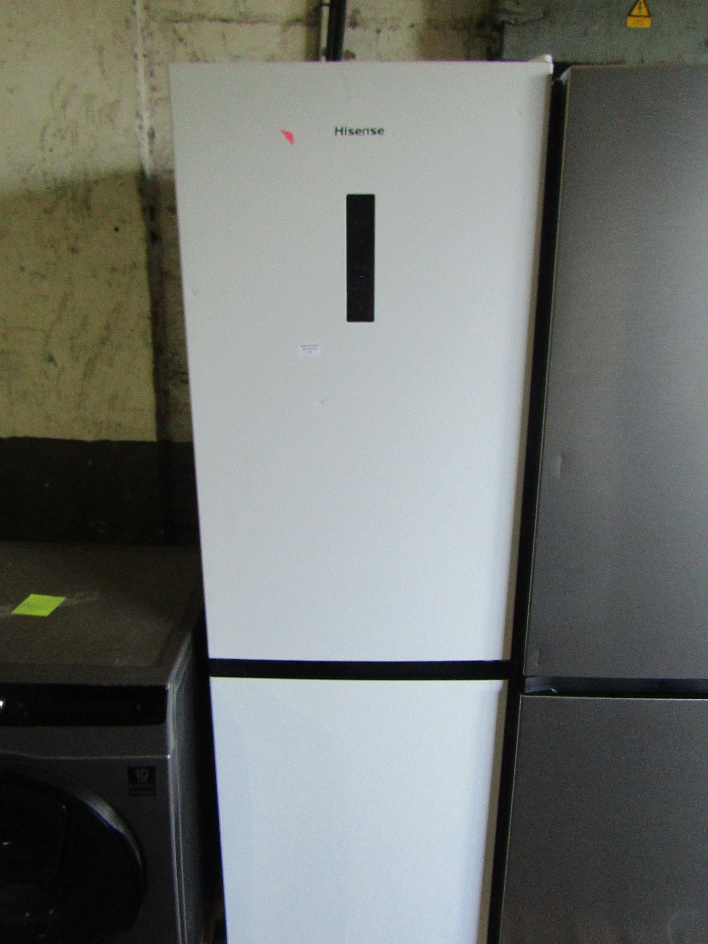 Hisense Free Standing Tall Fridge Freezer. White, Vendor Suggests Item Is Working, Model Number -