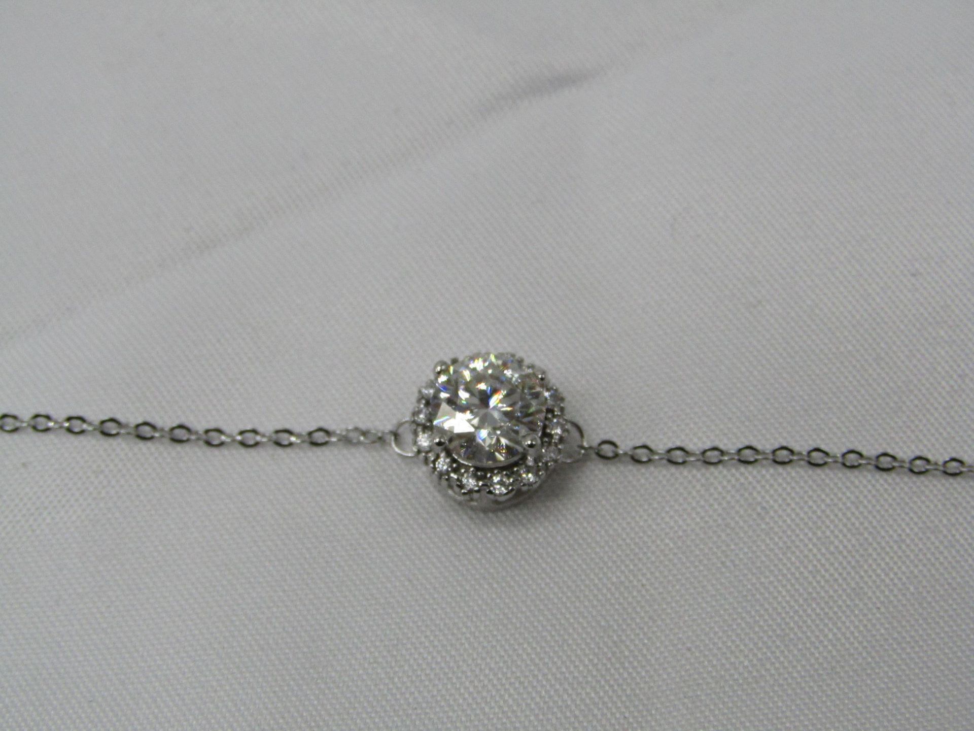 1 Carat Round Brilliant Cut Moissanite stone in a 925 Silver setting and Bracelet, new and comes