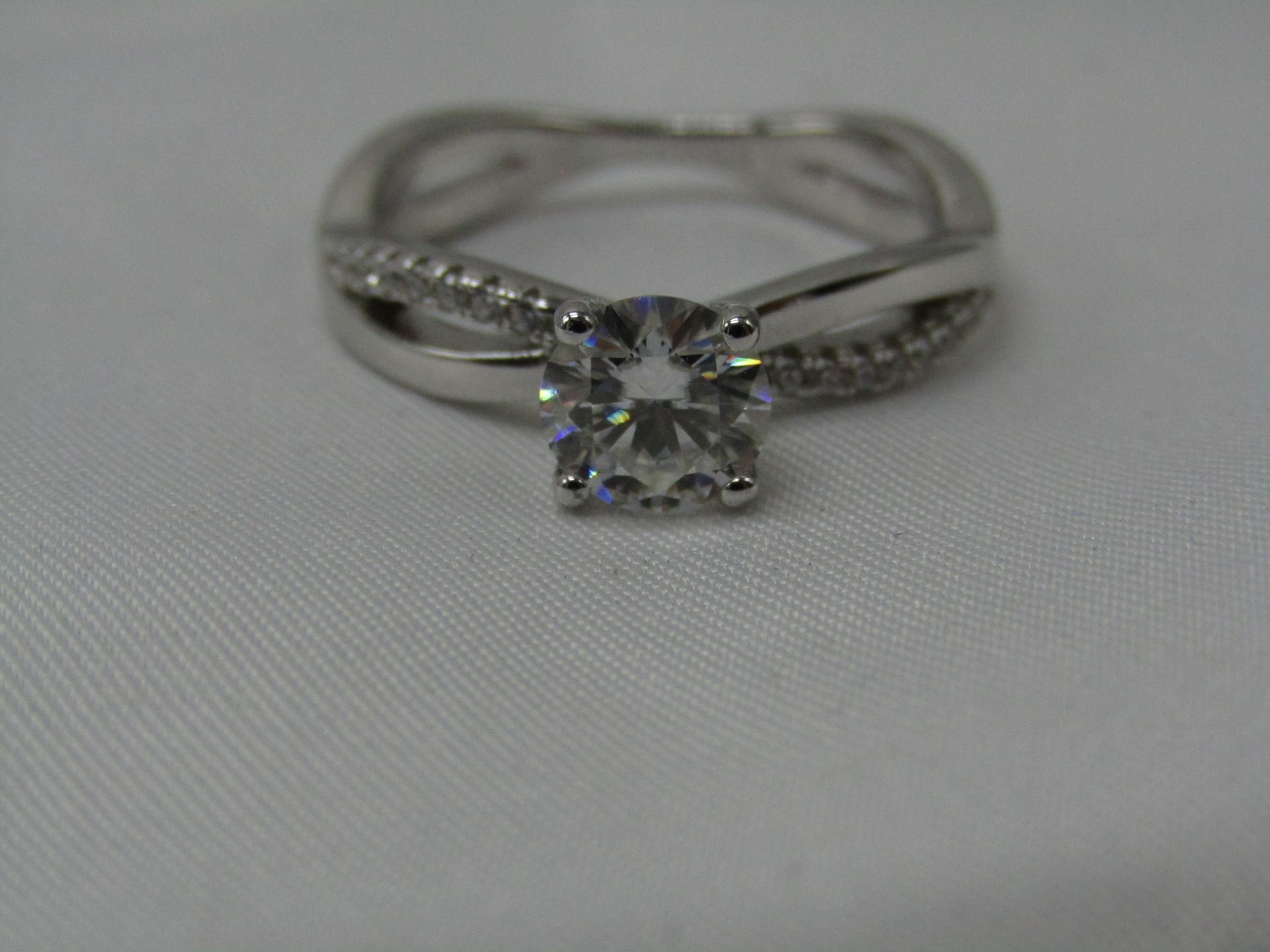 1 Carat Round Brilliant Cut Moissanite stone in a 925 Silver setting and band, new and comes with