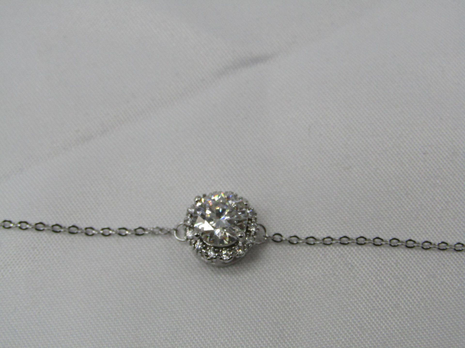 1 Carat Round Brilliant Cut Moissanite stone in a 925 Silver setting and Bracelet, new and comes