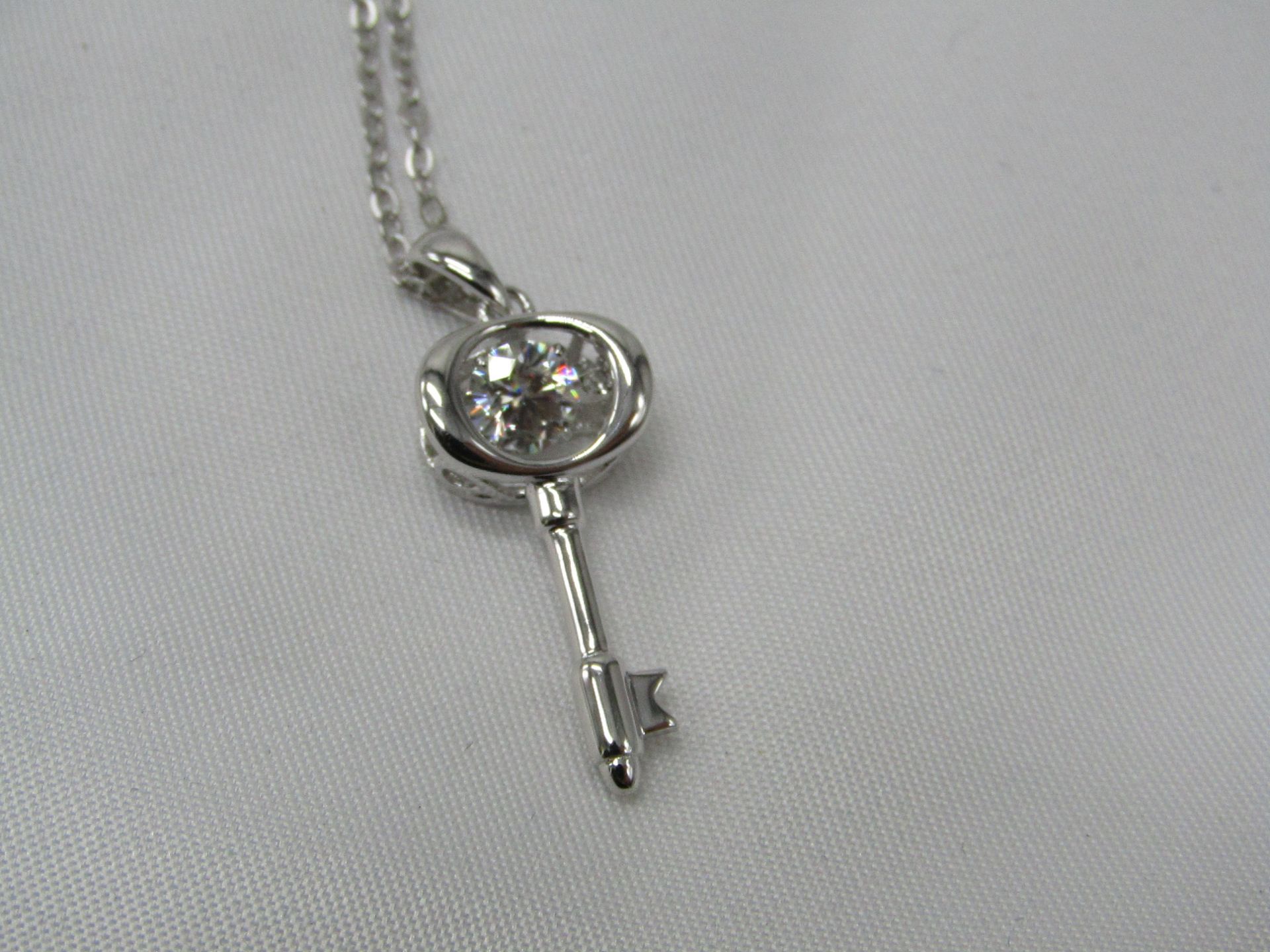 0.5 Carat Round Brilliant Cut Moissanite stone in a 925 Silver setting and Necklace, new and comes