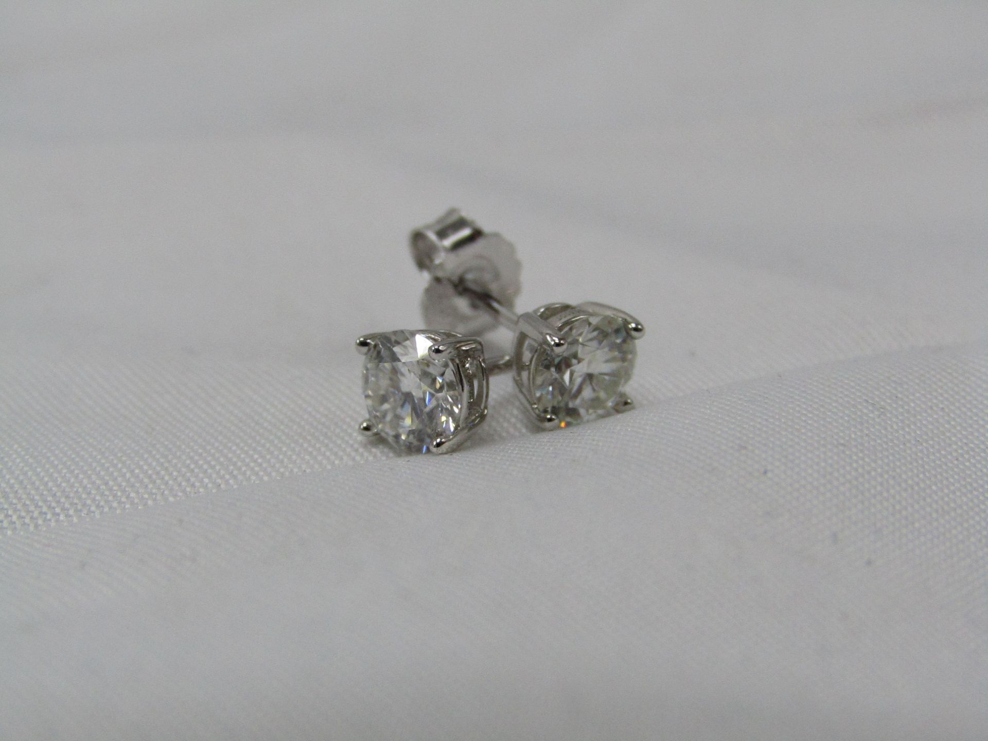 0.5 Carat Round Brilliant Cut Moissanite stone in a 925 Silver setting earrings, new and comes