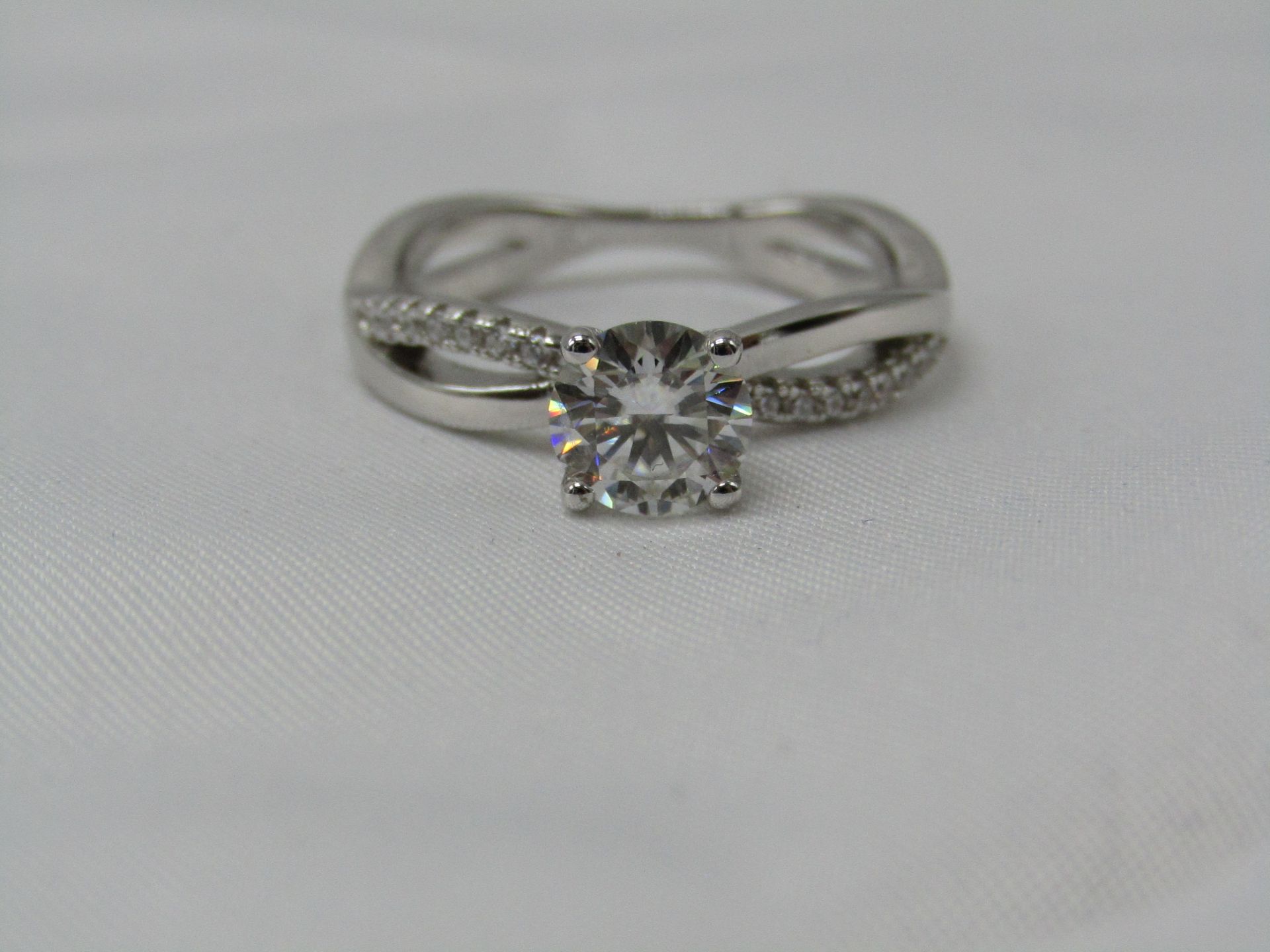 1 Carat Round Brilliant Cut Moissanite stone in a 925 Silver setting and band, new and comes with