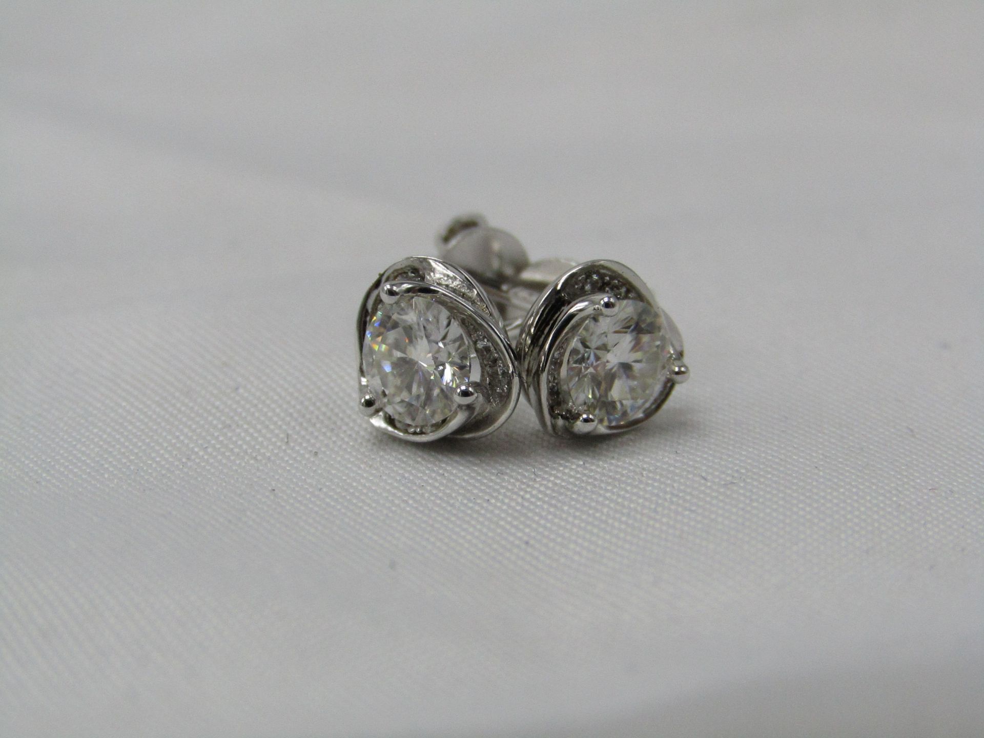 0.5 Carat Round Brilliant Cut Moissanite stone in a 925 Silver setting earrings, new and comes