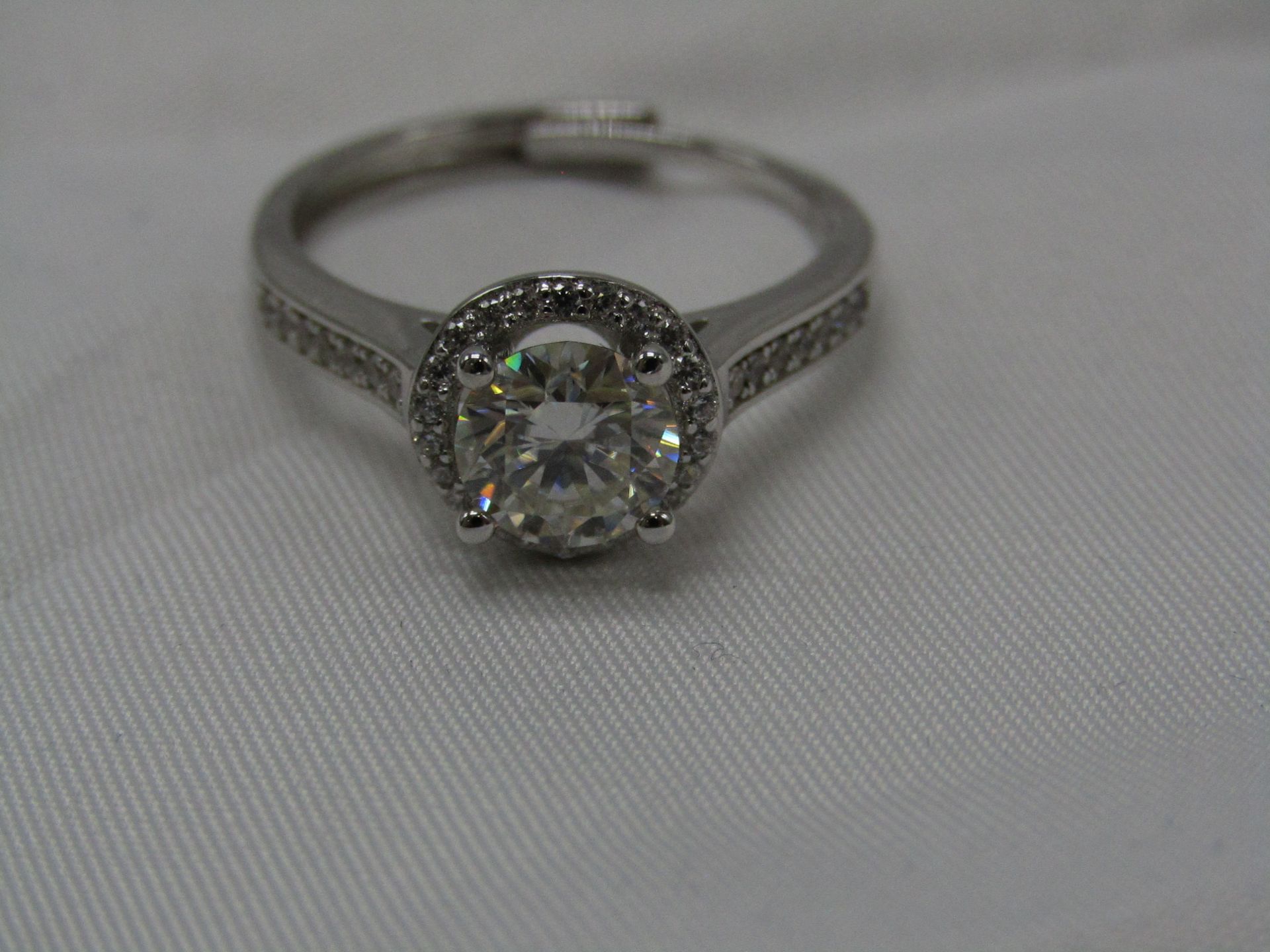 1 Carat Round Brilliant Cut Moissanite stone in a 925 Silver setting and band, new and comes with