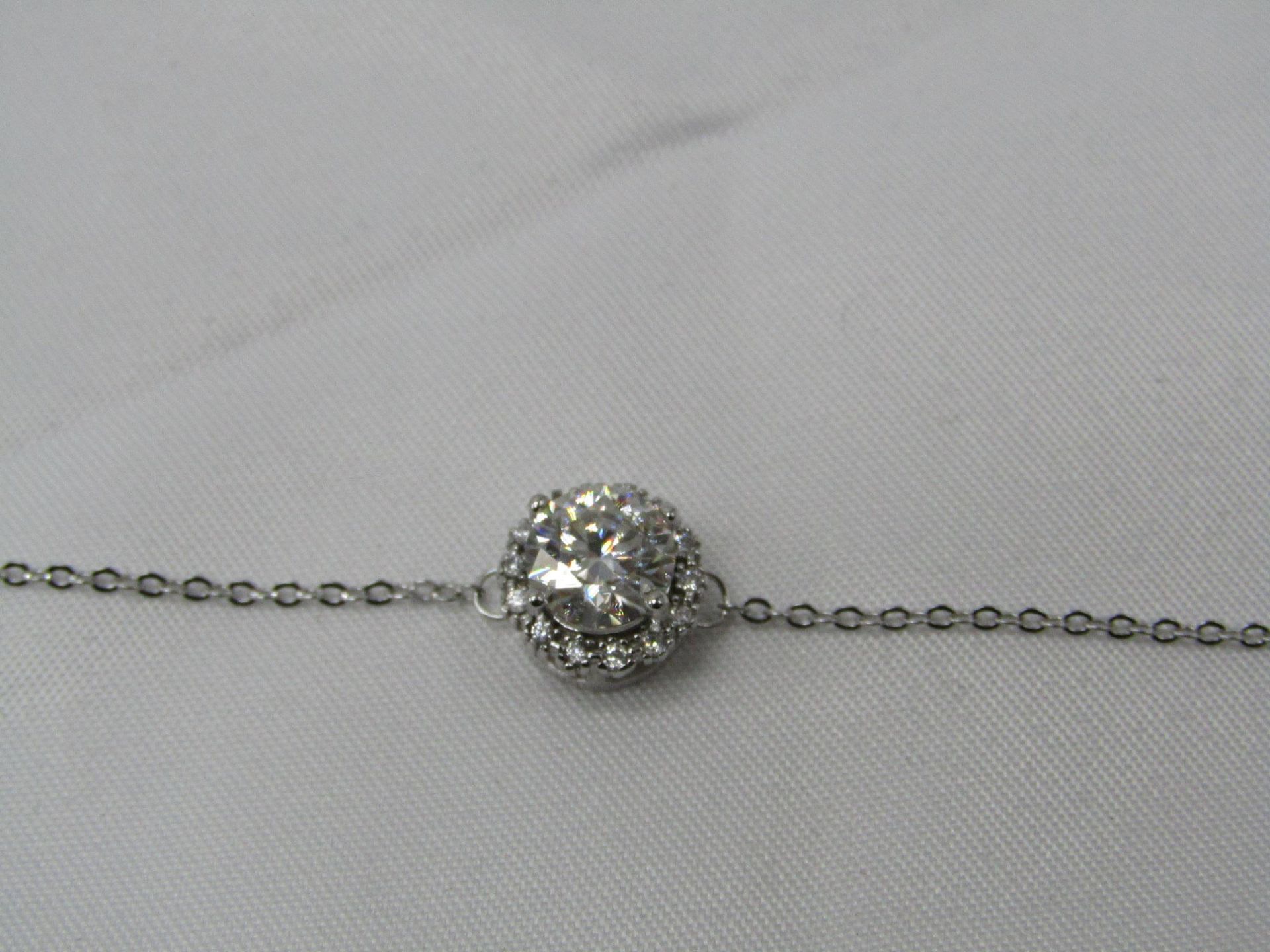 1 Carat Round Brilliant Cut Moissanite stone in a 925 Silver setting and Bracelet, new and comes