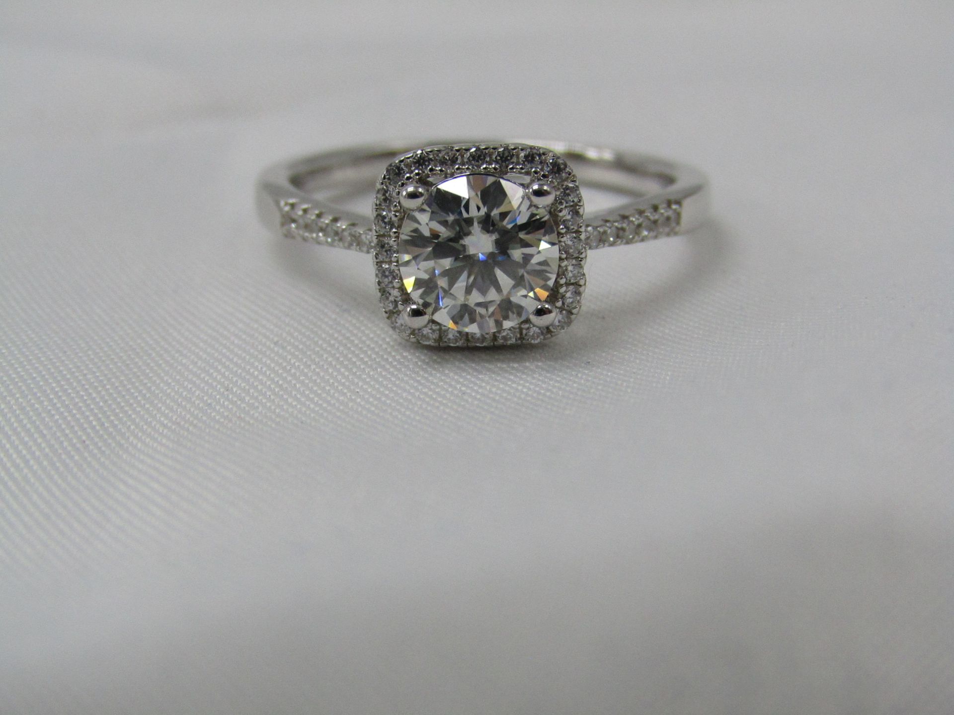 1 Carat Round Brilliant Cut Moissanite stone in a 925 Silver setting and band, new and comes with