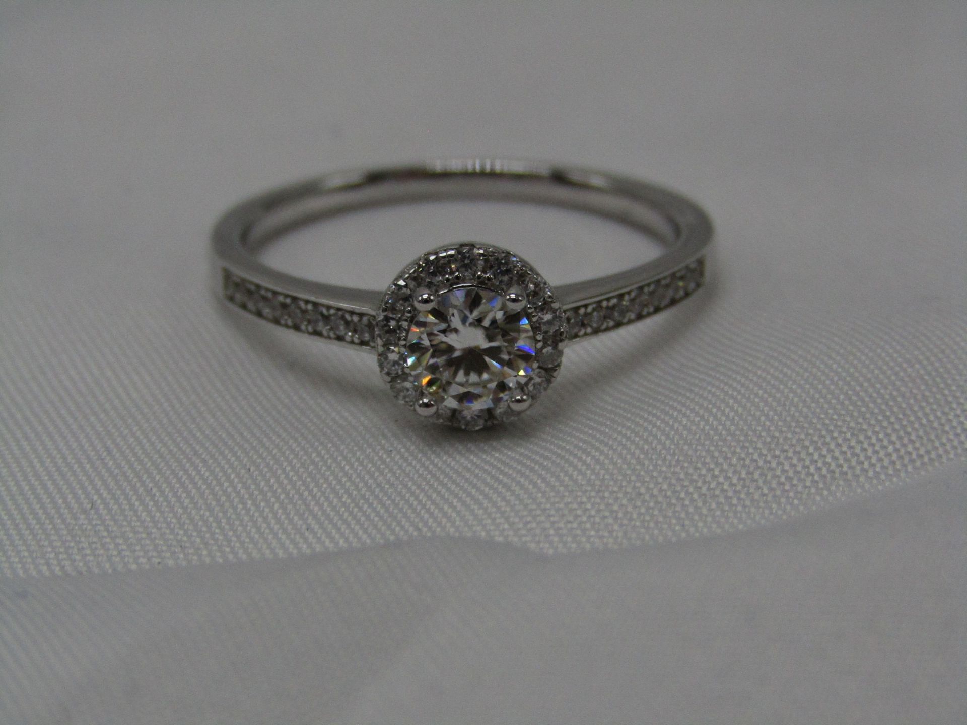 1 Carat Round Brilliant Cut Moissanite stone in a 925 Silver setting and band, new and comes with