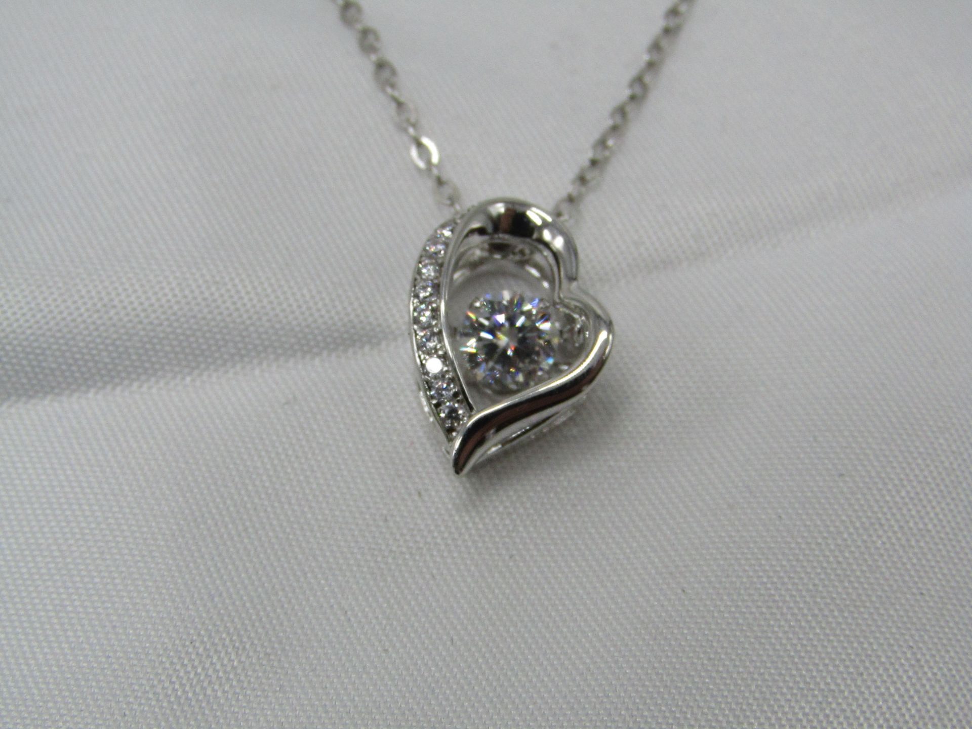 0.5 Carat Round Brilliant Cut Moissanite stone in a 925 Silver setting and Necklace, new and comes