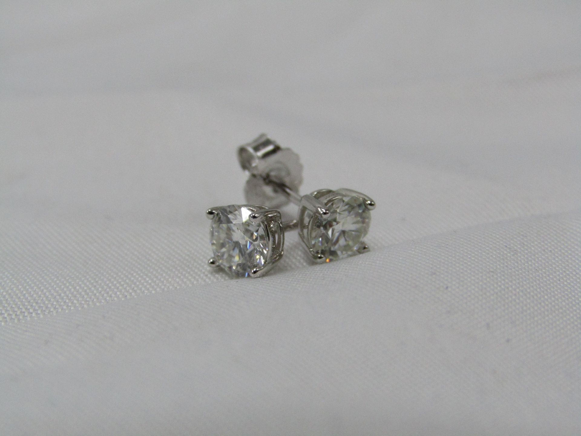 0.5 Carat Round Brilliant Cut Moissanite stone in a 925 Silver setting earrings, new and comes