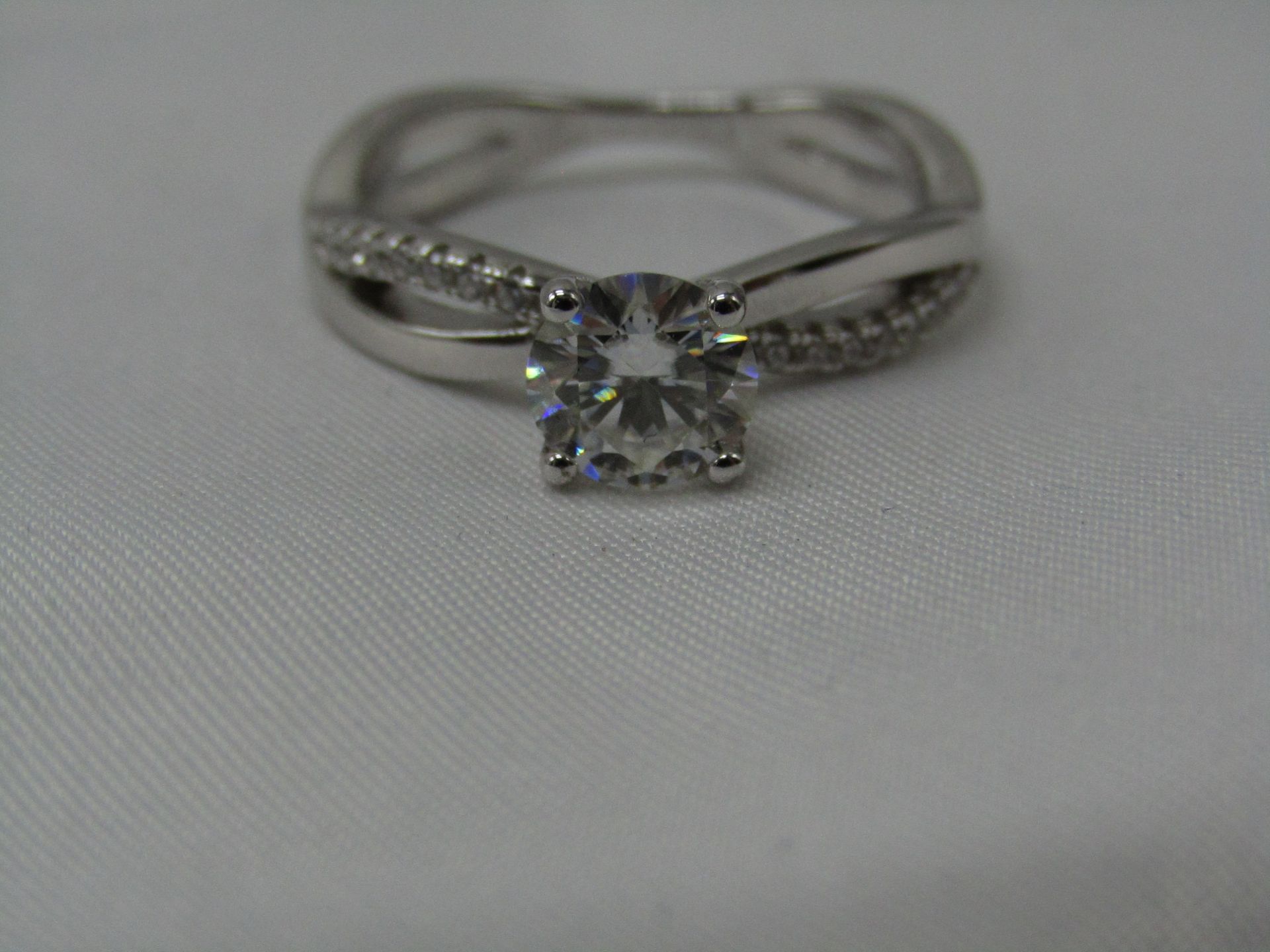 1 Carat Round Brilliant Cut Moissanite stone in a 925 Silver setting and band, new and comes with