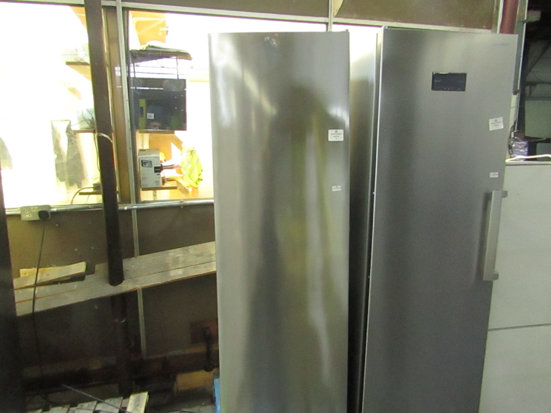 Smeg tall freestanding fridge, not getting cold and has dents on the front.