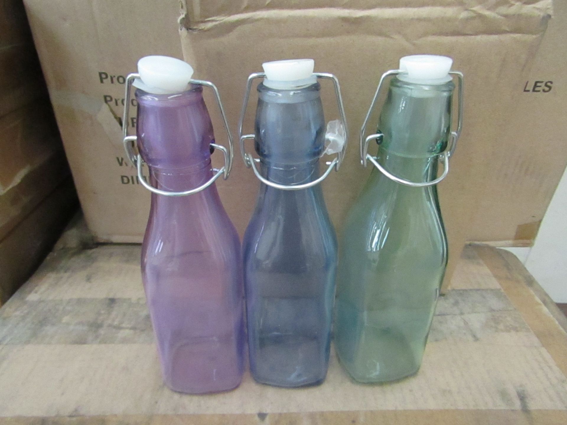 1x Box Containing 12 Sets Of 3 Being : Coloured Glass Bottles - 250ml - Please See Image For Design.