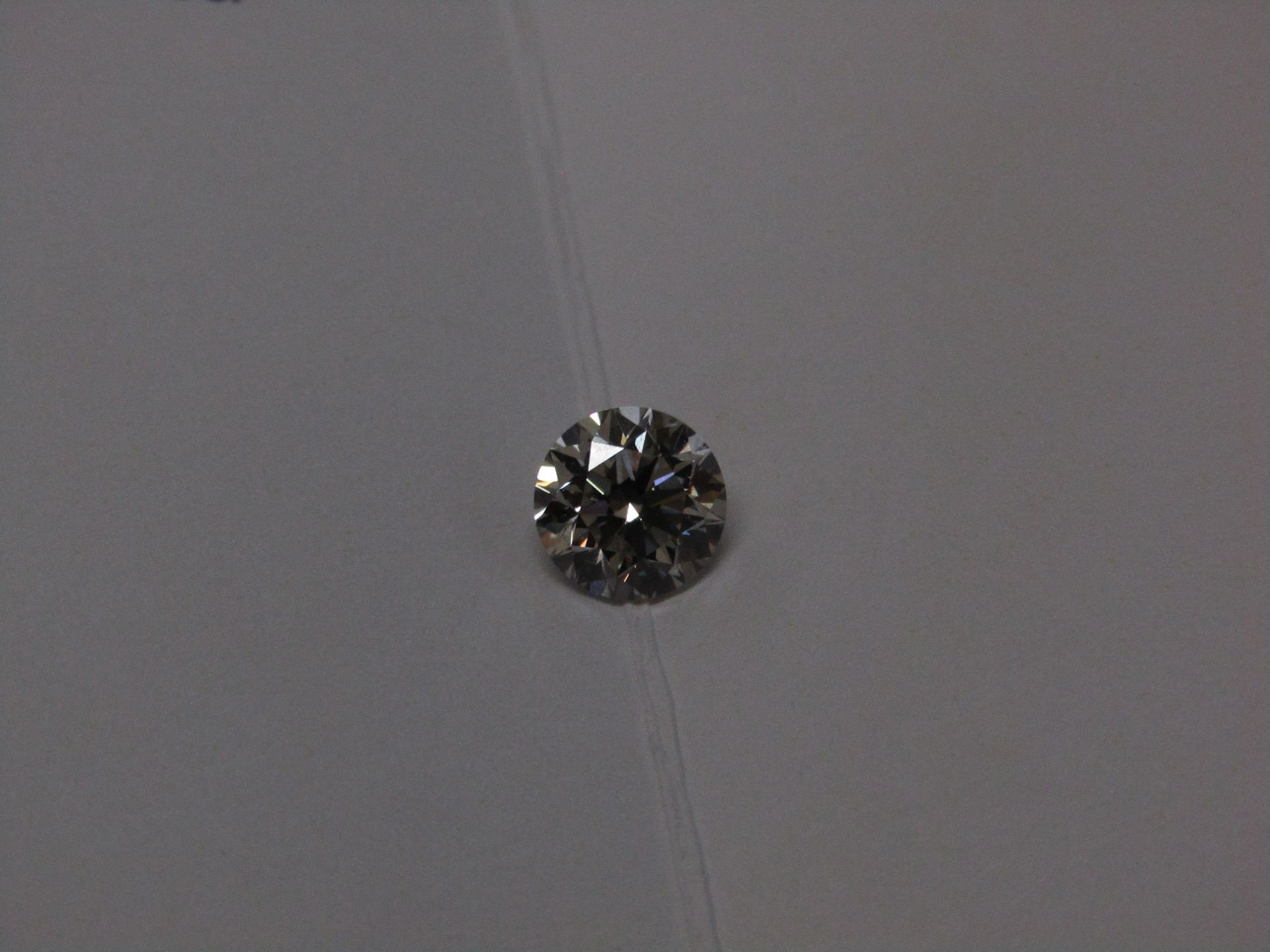 1 Carat round Brilliant cut, VS1, colour J, Synthetic Lab Diamond, comes with a IGI Certificate.