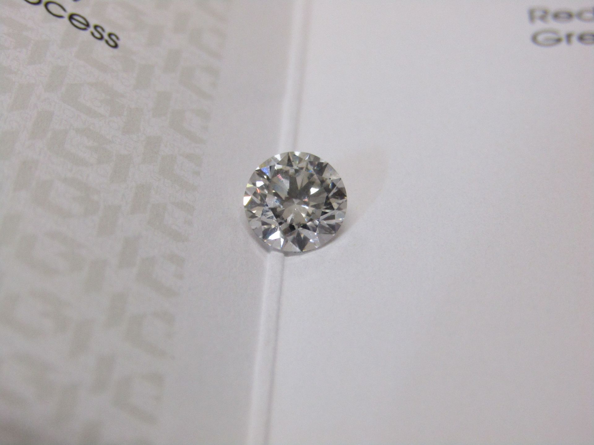 1.02 Carat round Brilliant cut, VS2, colour J, Synthetic Lab Diamond, comes with a IGI Certificate.