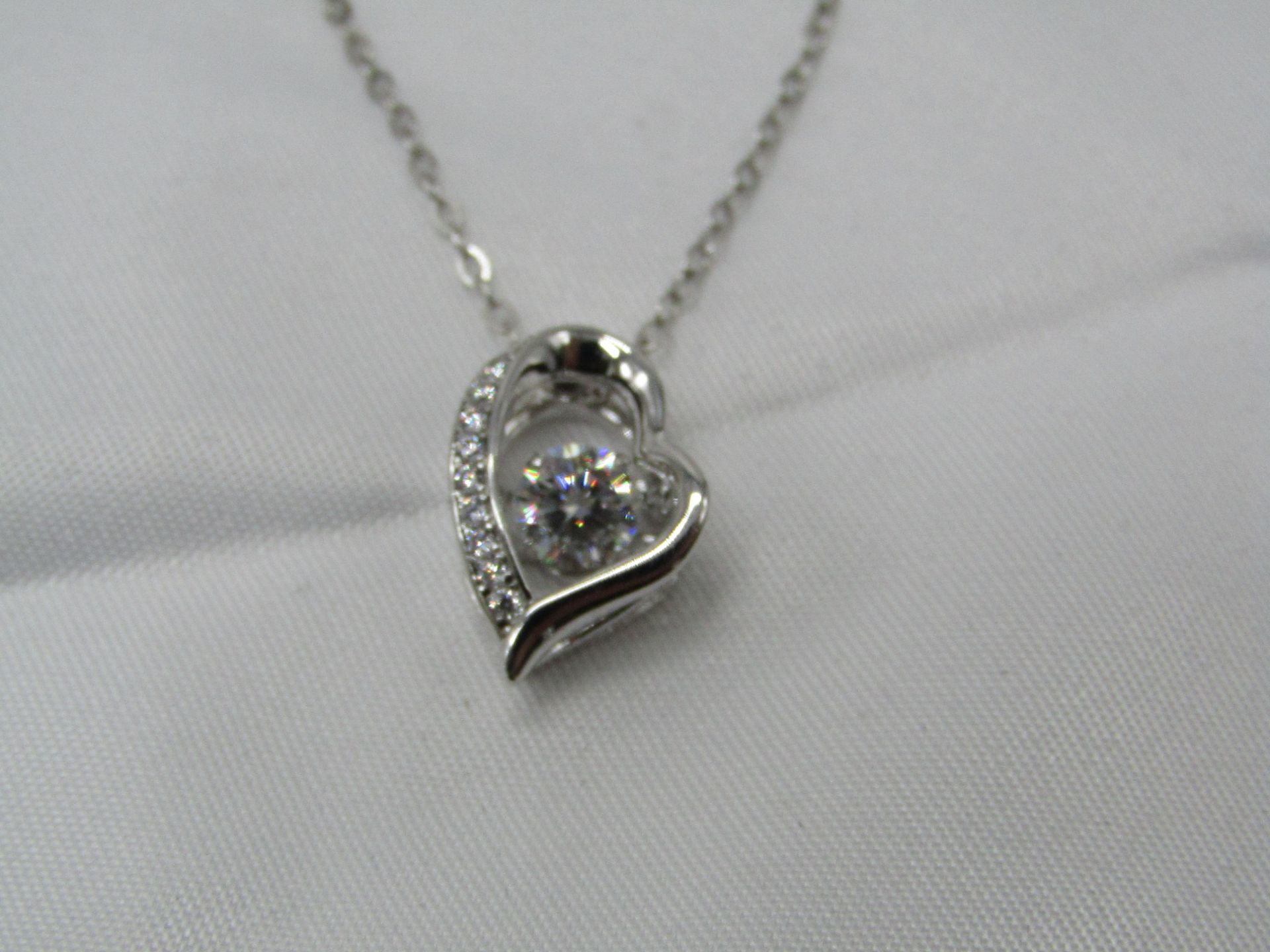 0.5 Carat Round Brilliant Cut Moissanite stone in a 925 Silver setting and Necklace, new and comes