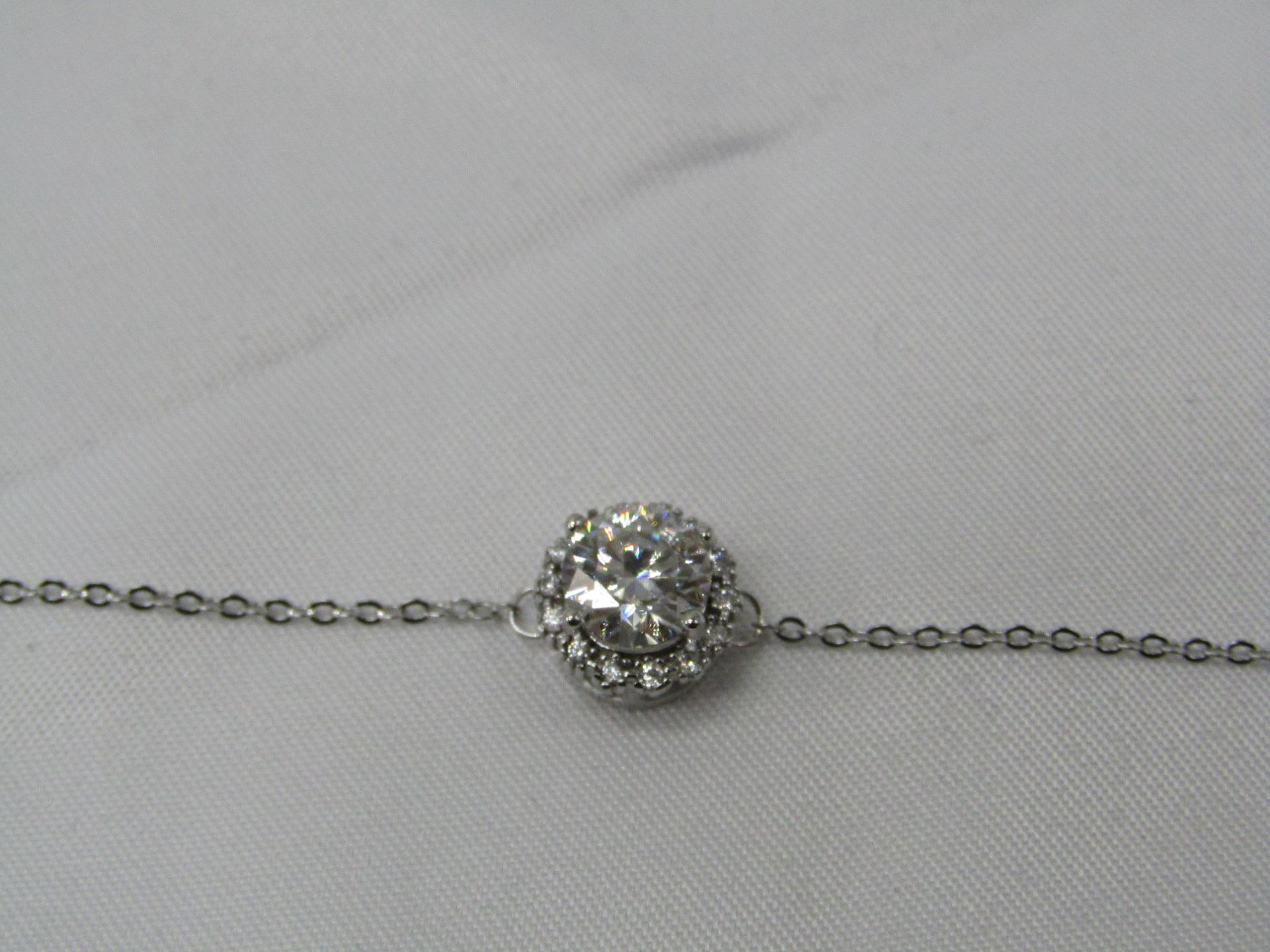 1 Carat Round Brilliant Cut Moissanite stone in a 925 Silver setting and Bracelet, new and comes