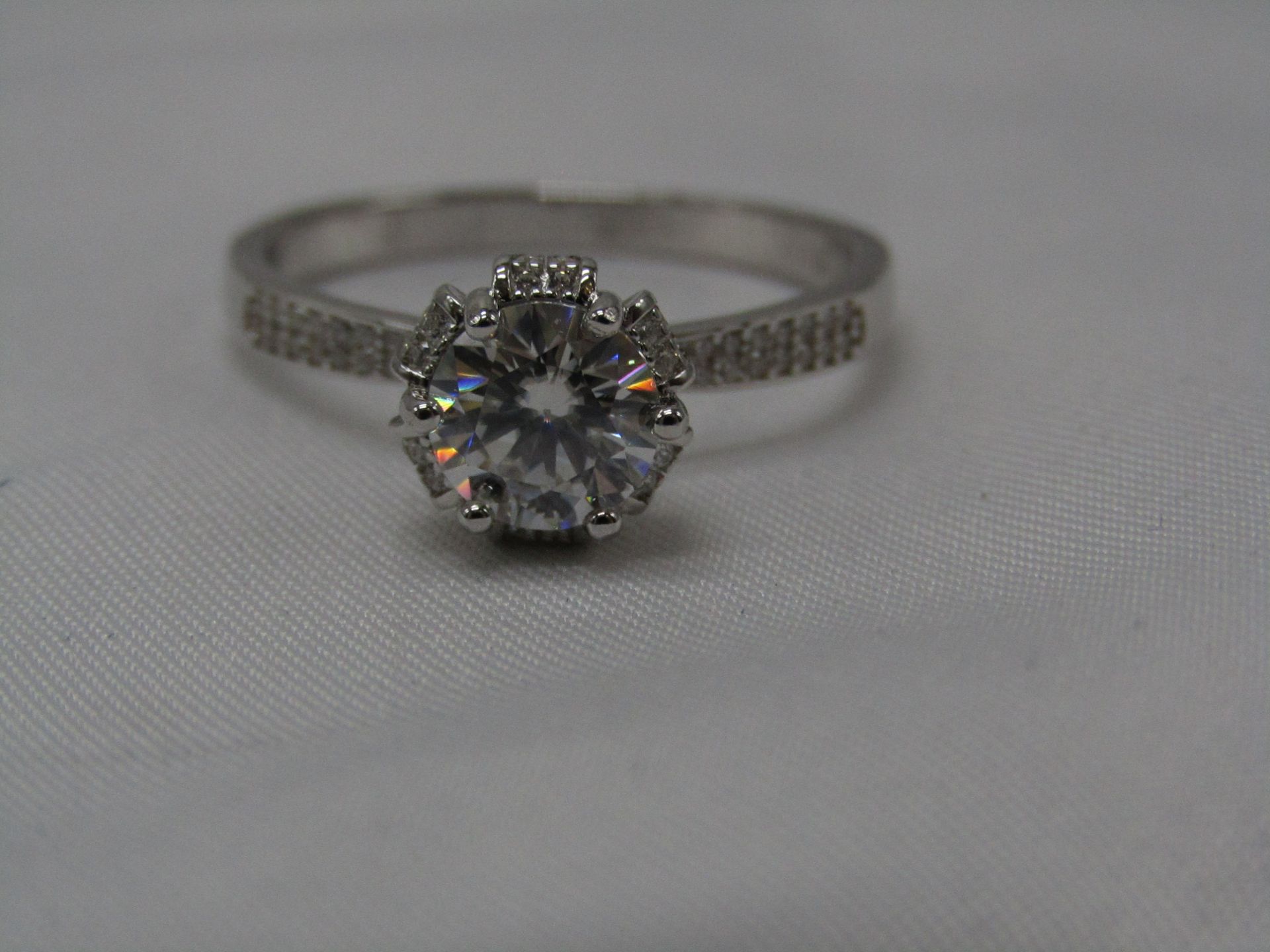 1 Carat Round Brilliant Cut Moissanite stone in a 925 Silver setting and band, new and comes with