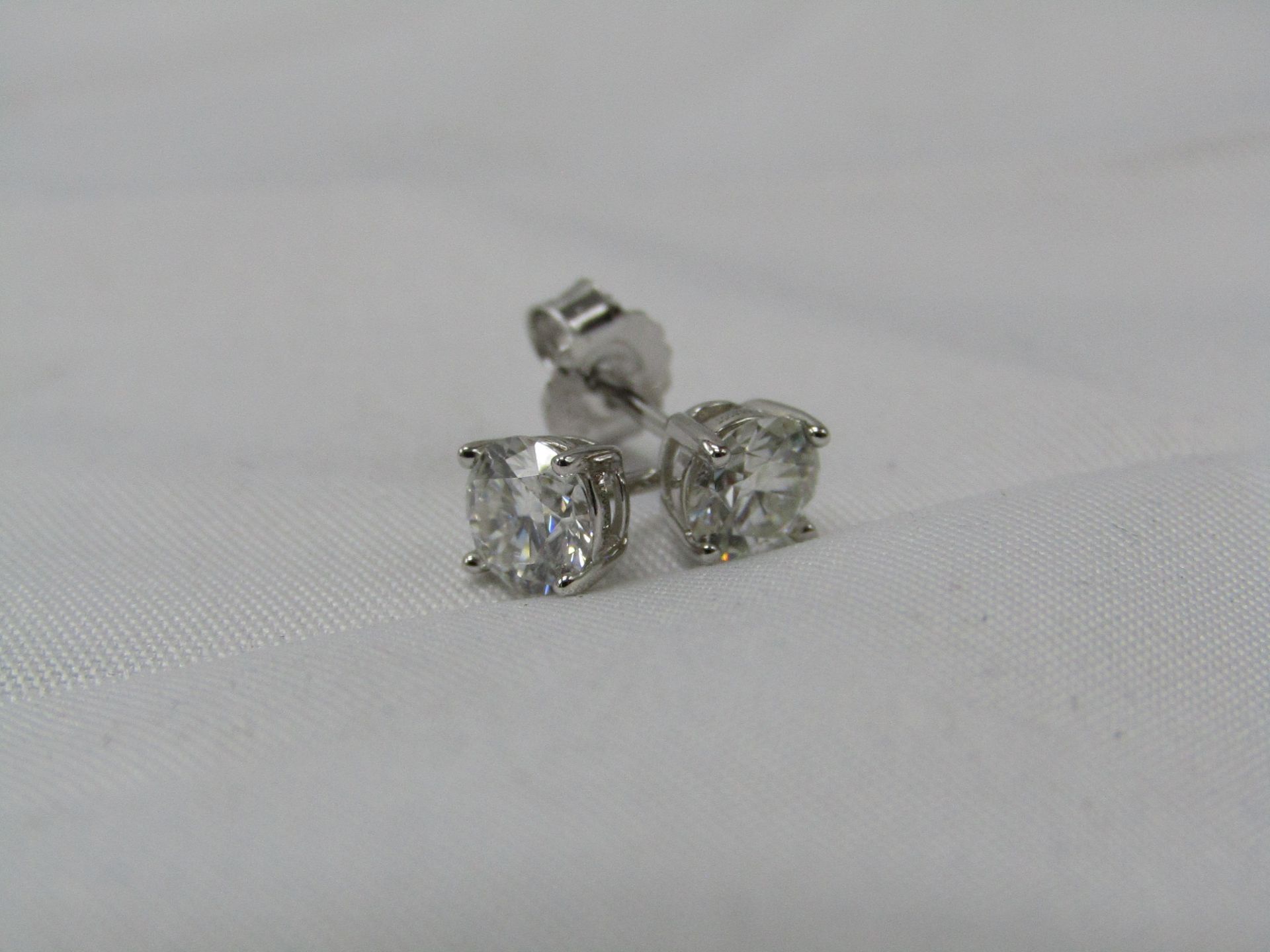 0.5 Carat Round Brilliant Cut Moissanite stone in a 925 Silver setting earrings, new and comes