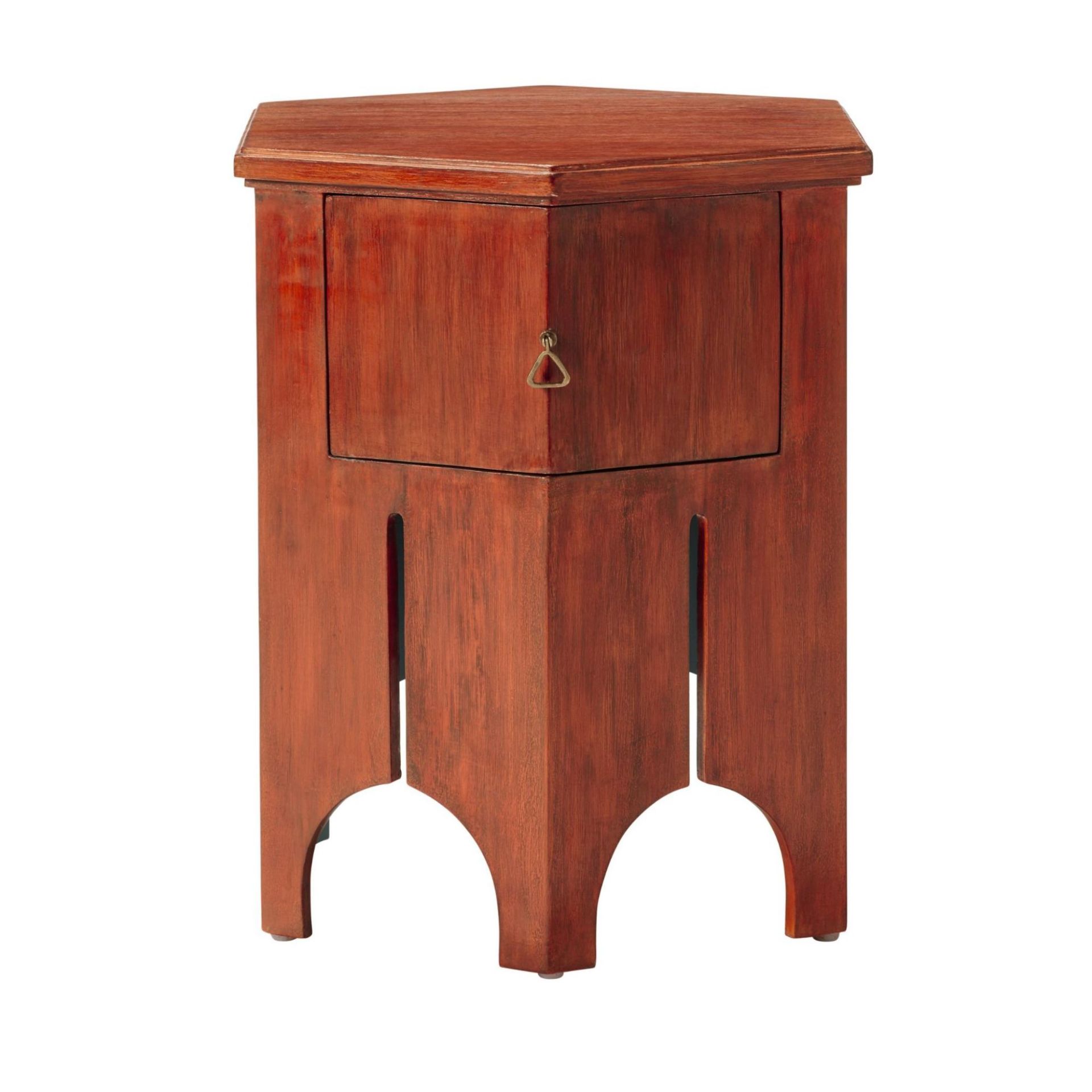 Finished to a rich red, this hexagonal side table draws inspiration from Morocco. Its drawer