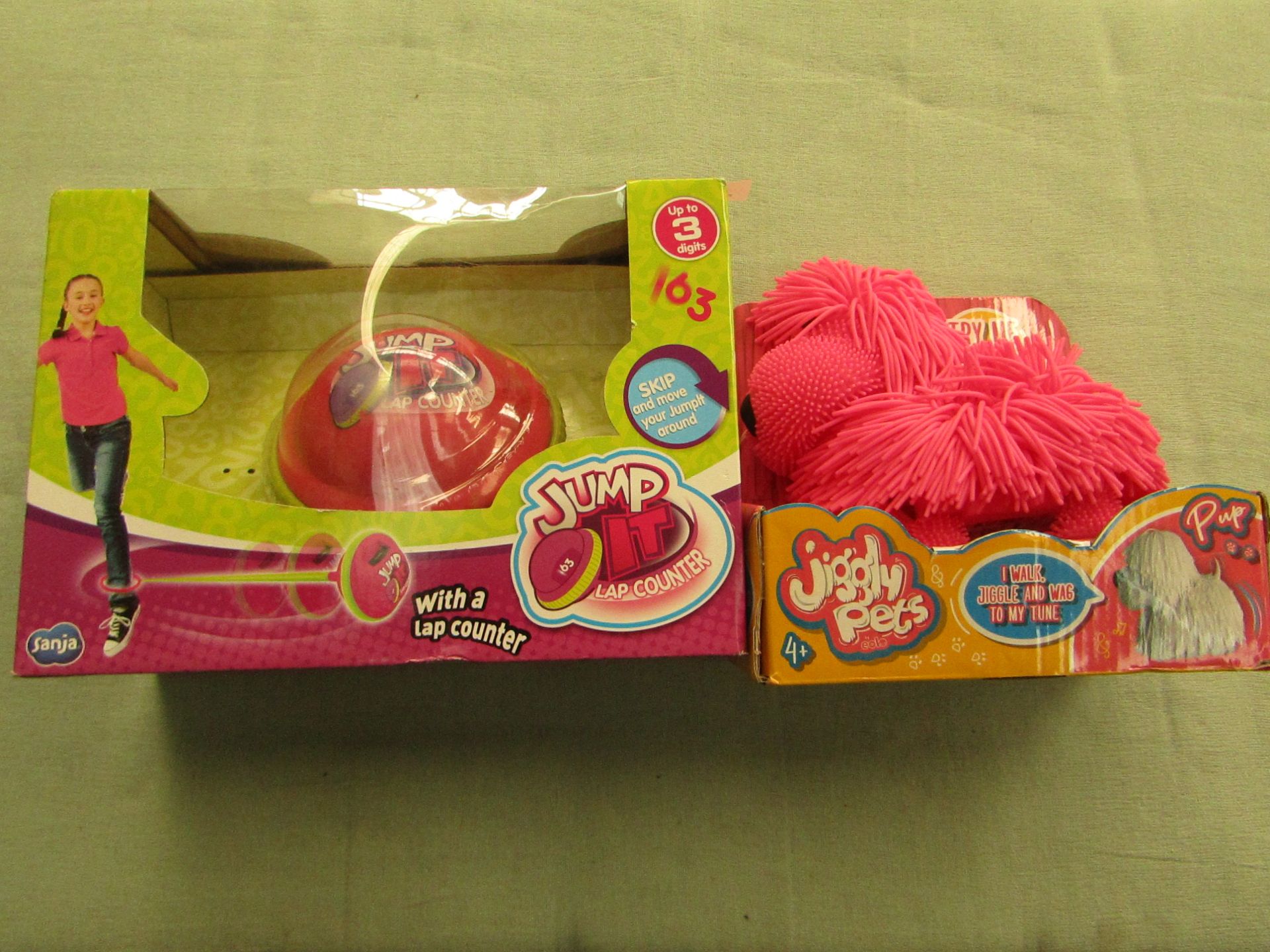 1x Eolo - Jiggly Pets Pink Pup - Unchecked & Packaged. 1x Just It - Skip Lap Counter - Unchecked &