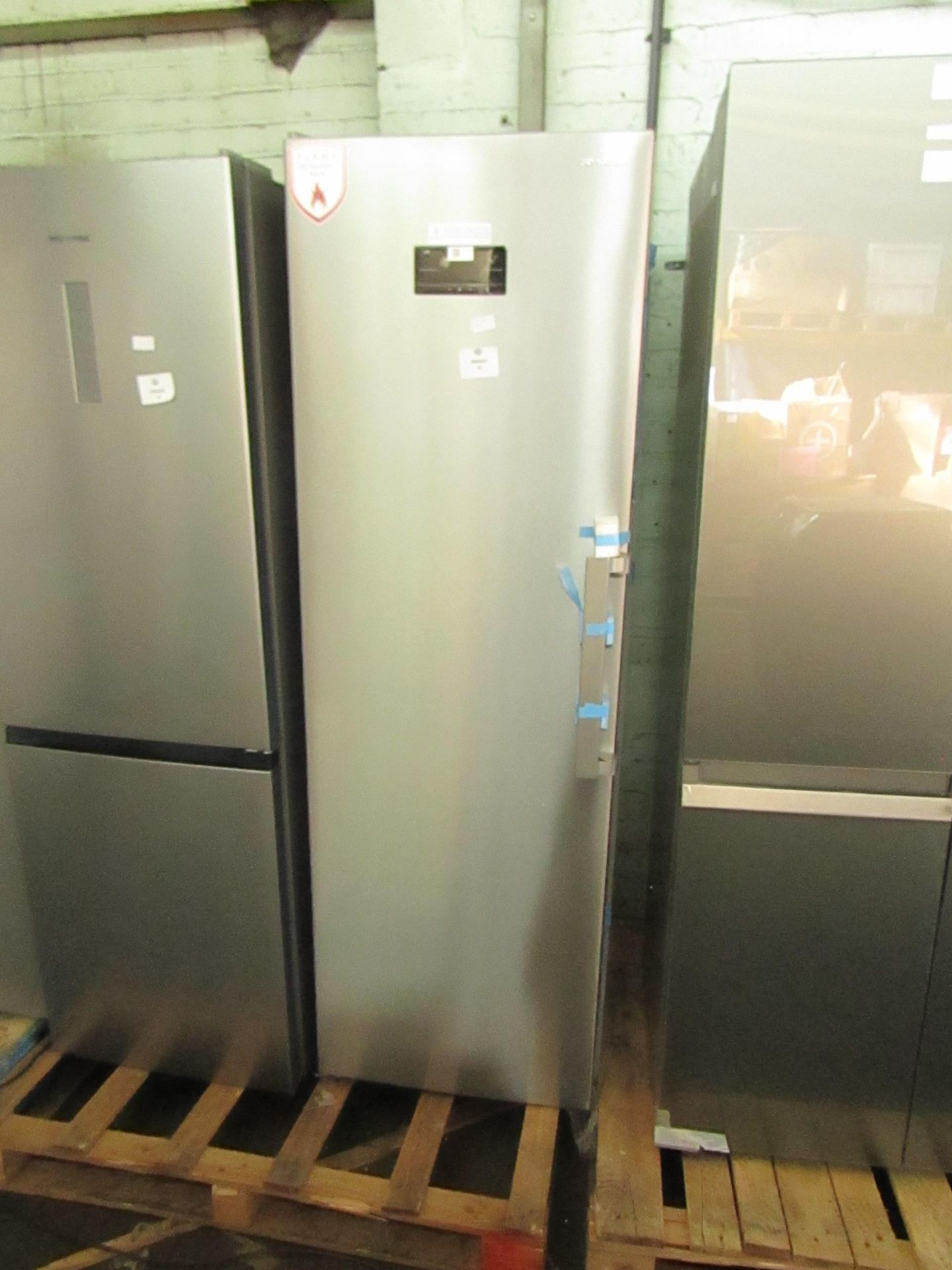 Sharp tall freestanding Freezer, Looks unused but one of the glass shelves has smashed inside,