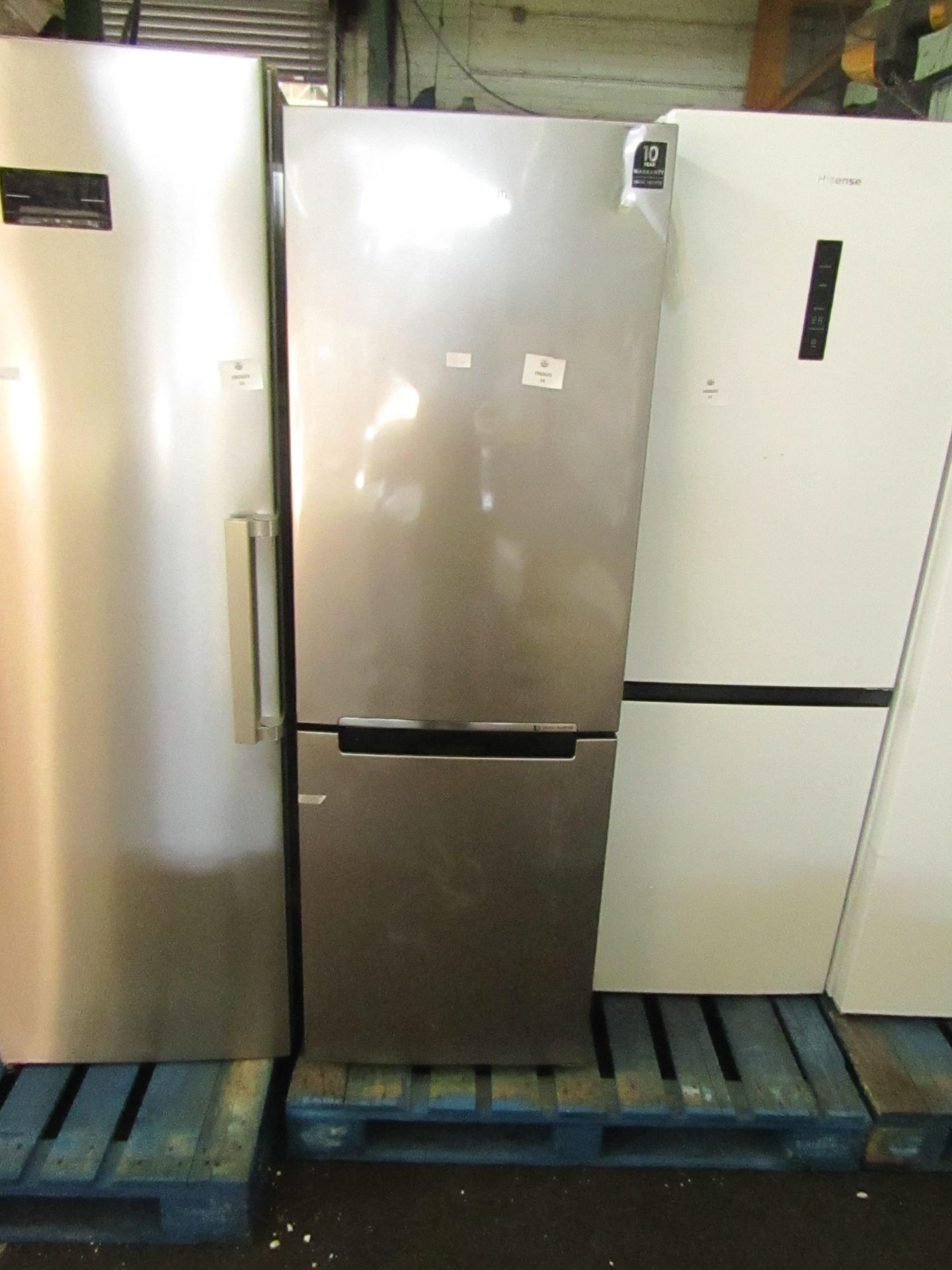 Samsung 60/40 fridge freezer, look unused insiode but has a few dents and marks on the front one