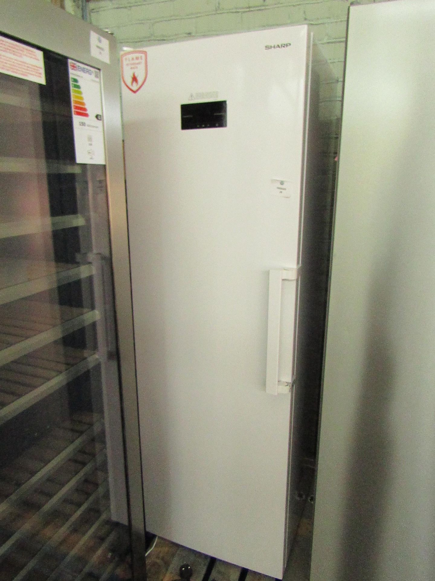 Sharp Tall Freestanding Freezer, clean inside, Onme of the covers is missing off the door handle