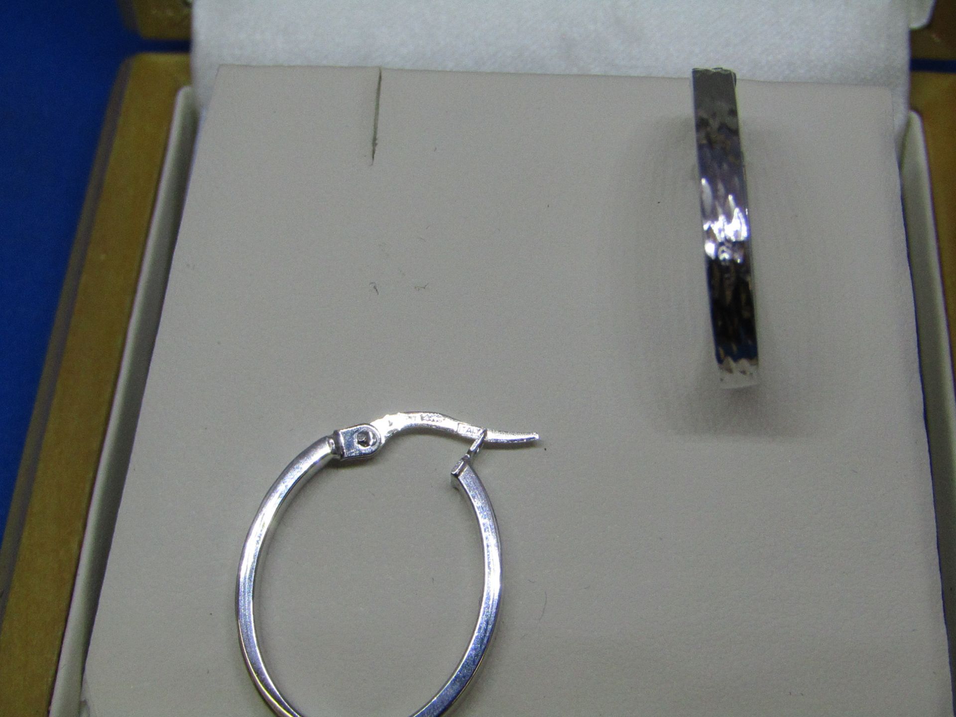 14k white Gold diamond cut loop earrings, look to be in good condition.