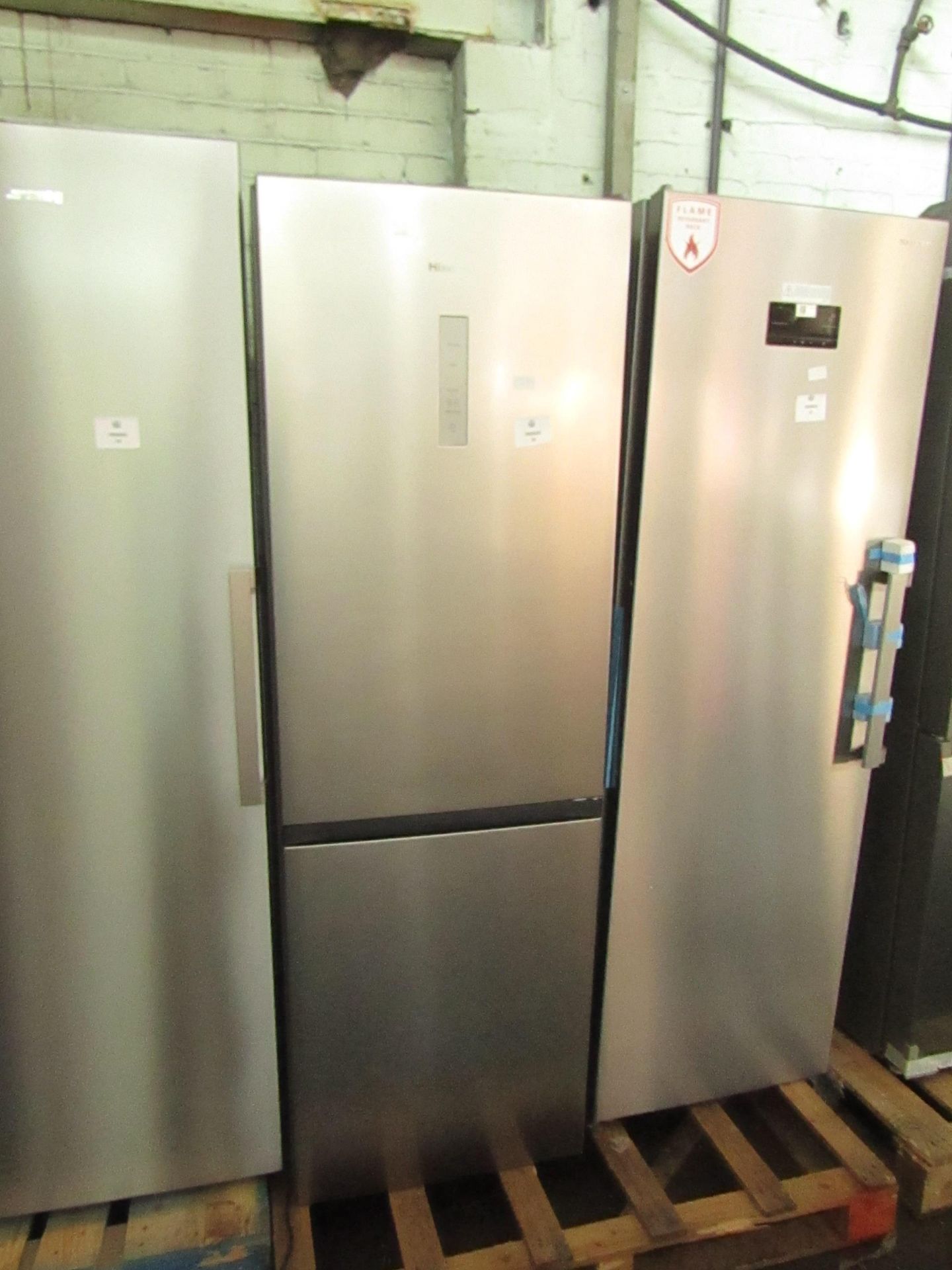 Hisense 60/40 fridge freezer, clean insode and a couple of small dents on the fridge door, tested