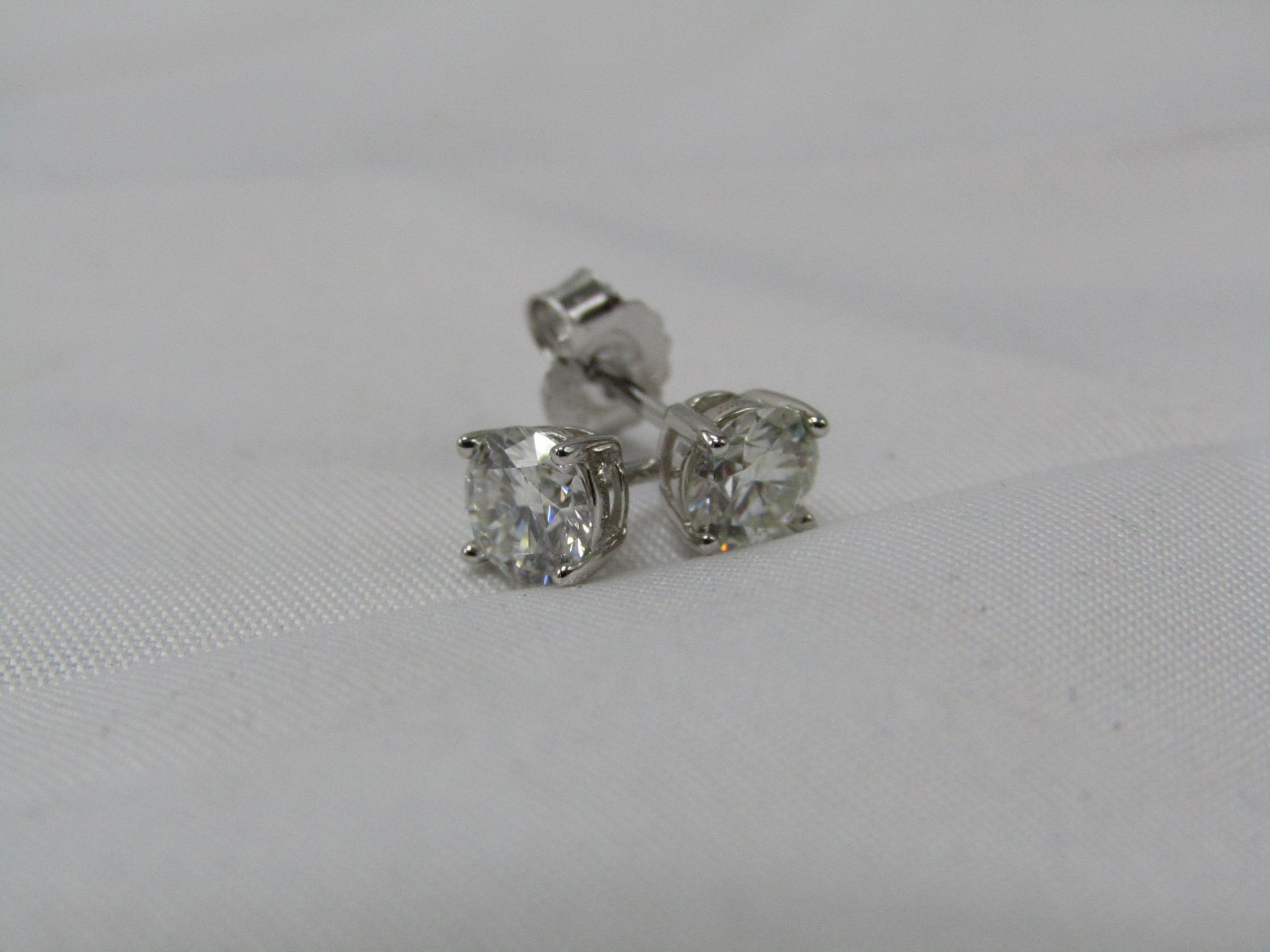 0.5 Carat Round Brilliant Cut Moissanite stone in a 925 Silver setting earrings, new and comes