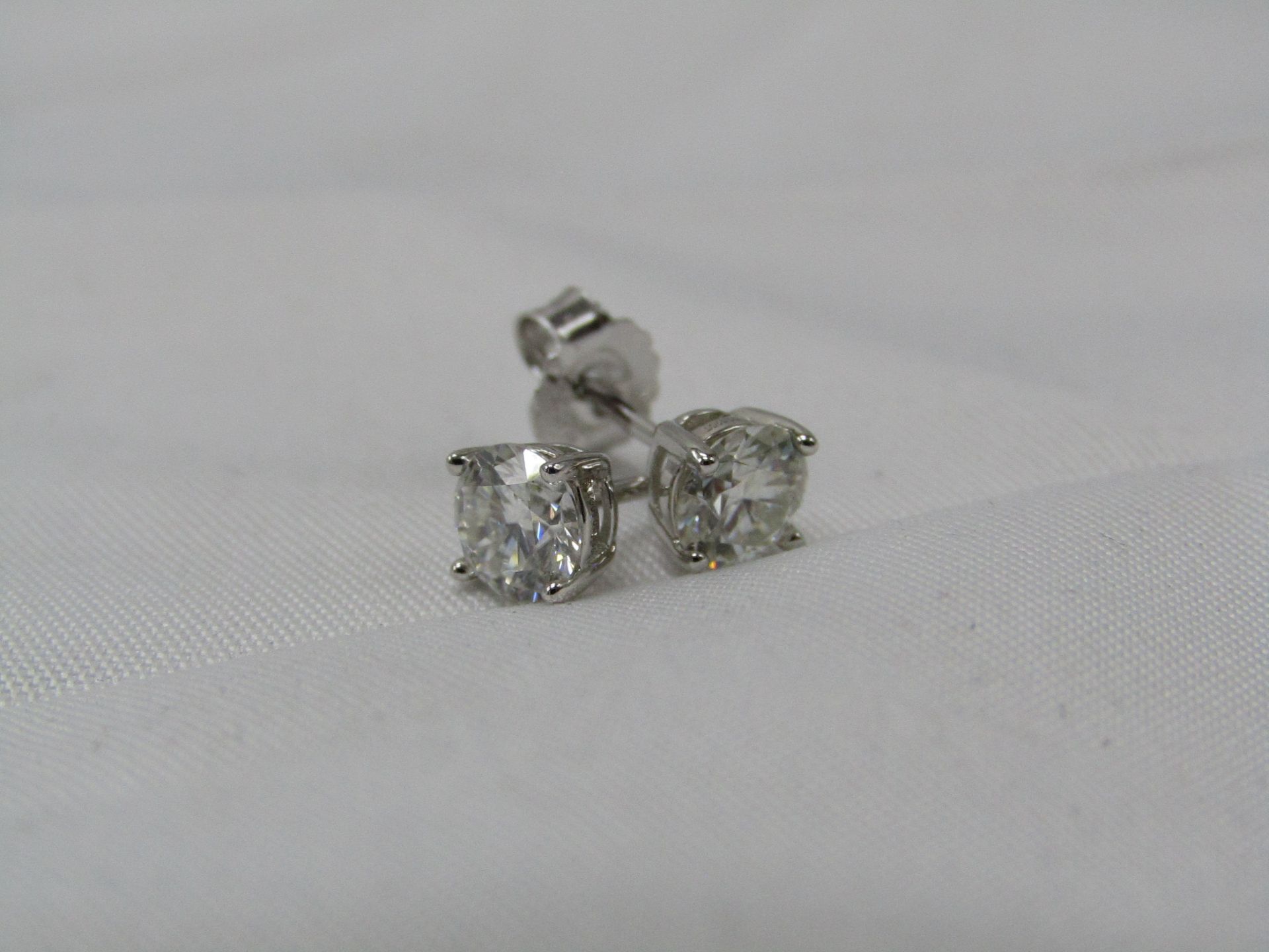 0.5 Carat Round Brilliant Cut Moissanite stone in a 925 Silver setting earrings, new and comes