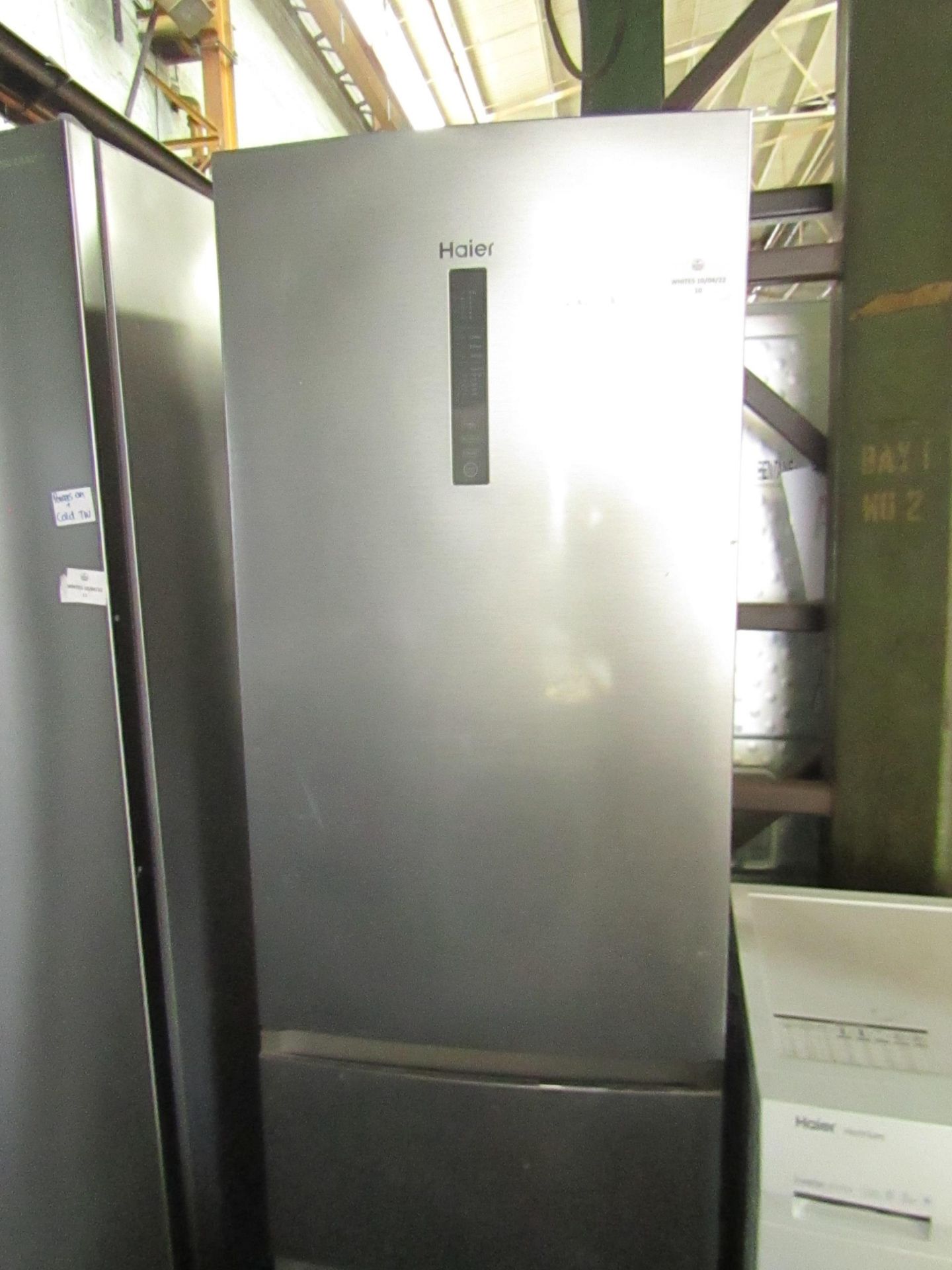 Haier Fridge Freezer, Could do with a clean inside, has a few dents nad marks on the front