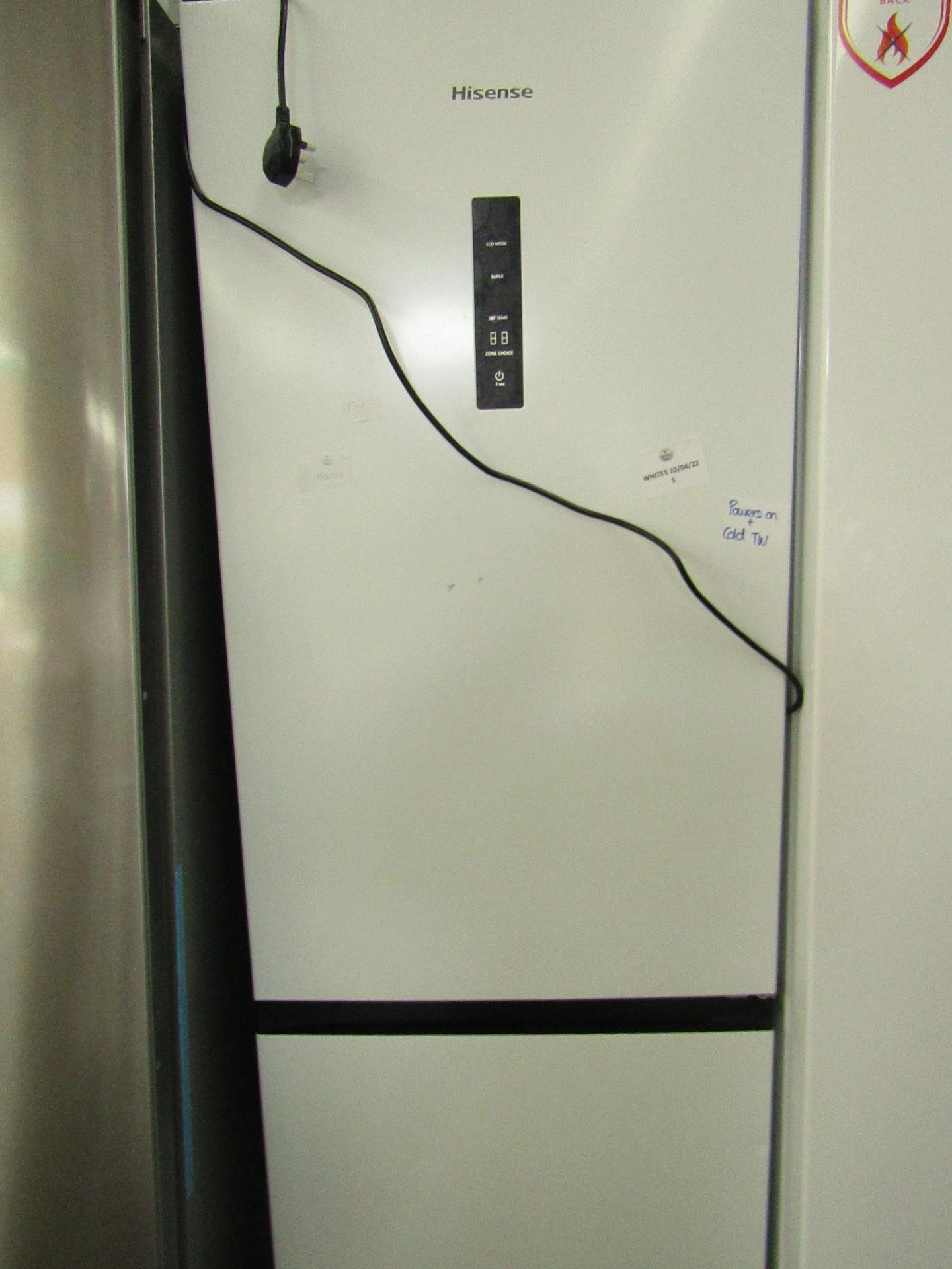 Hisense Fridge freezer, clean inside and one small dent on the freezer door, Tested working for