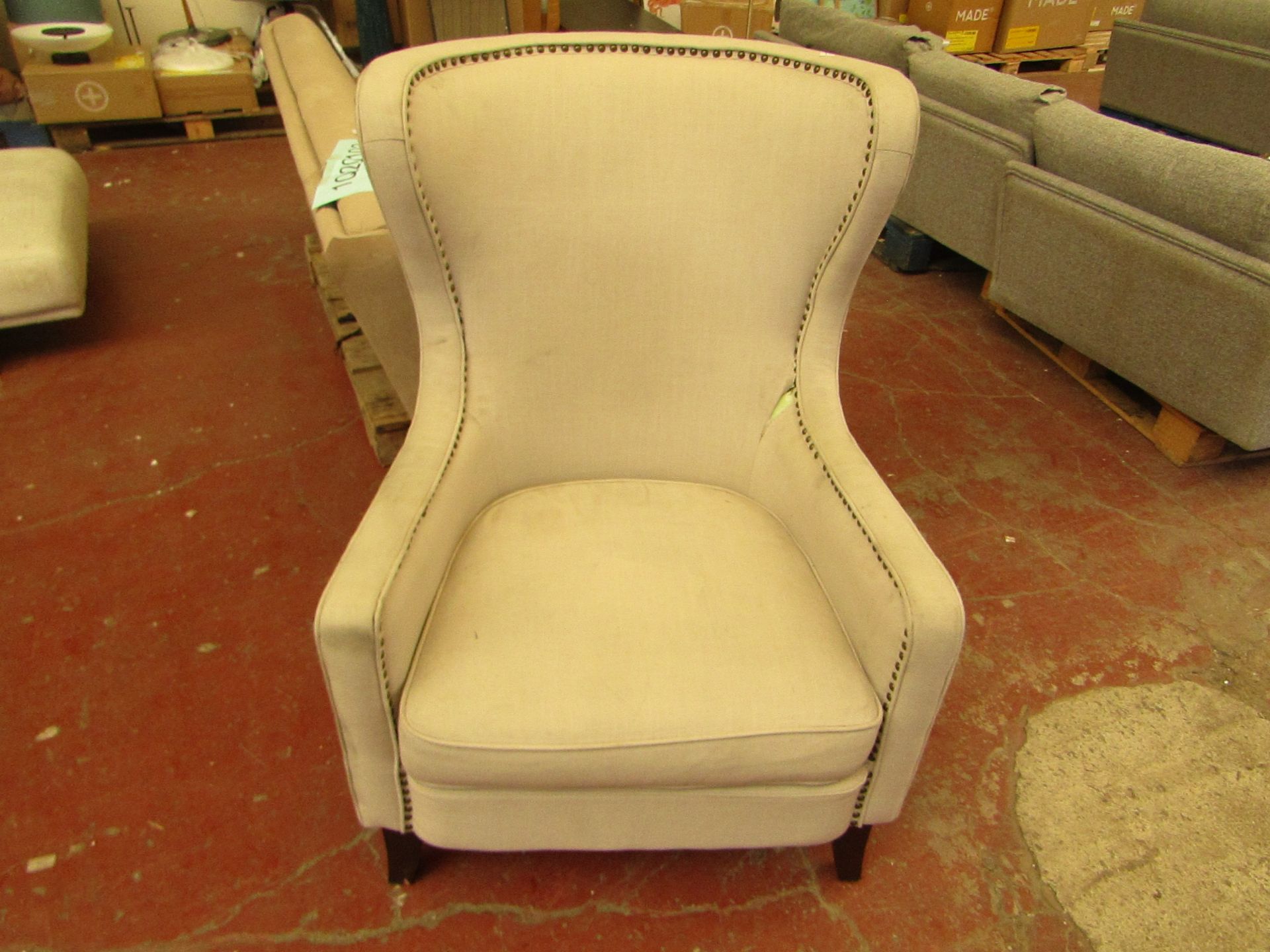 !x tall wing back chair, needs a clean but other than that appears to be ina good condition