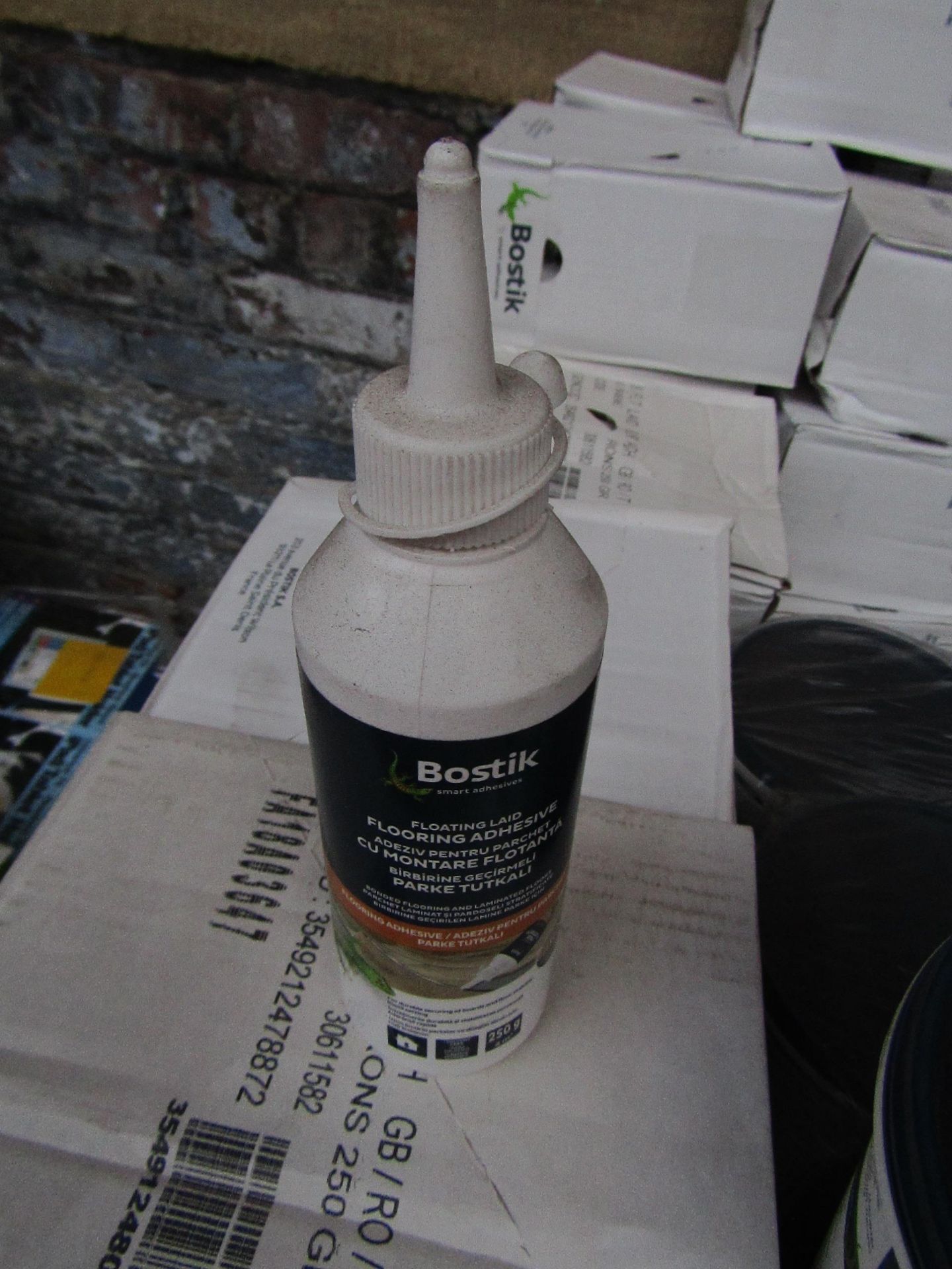 Box of 6x 250g bottles of Bostik Laminate floor adhesive, new and still sealed