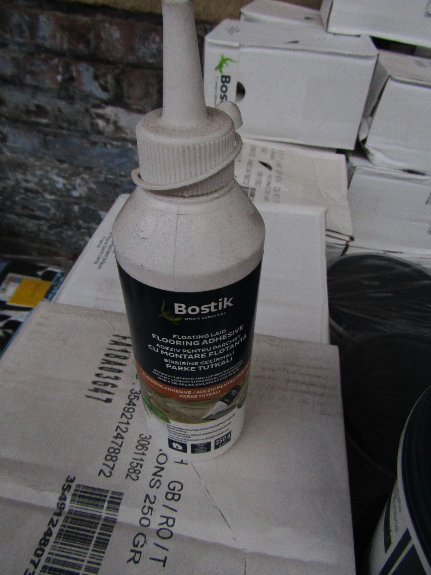 Box of 6x 250g bottles of Bostik Laminate floor adhesive, new and still sealed